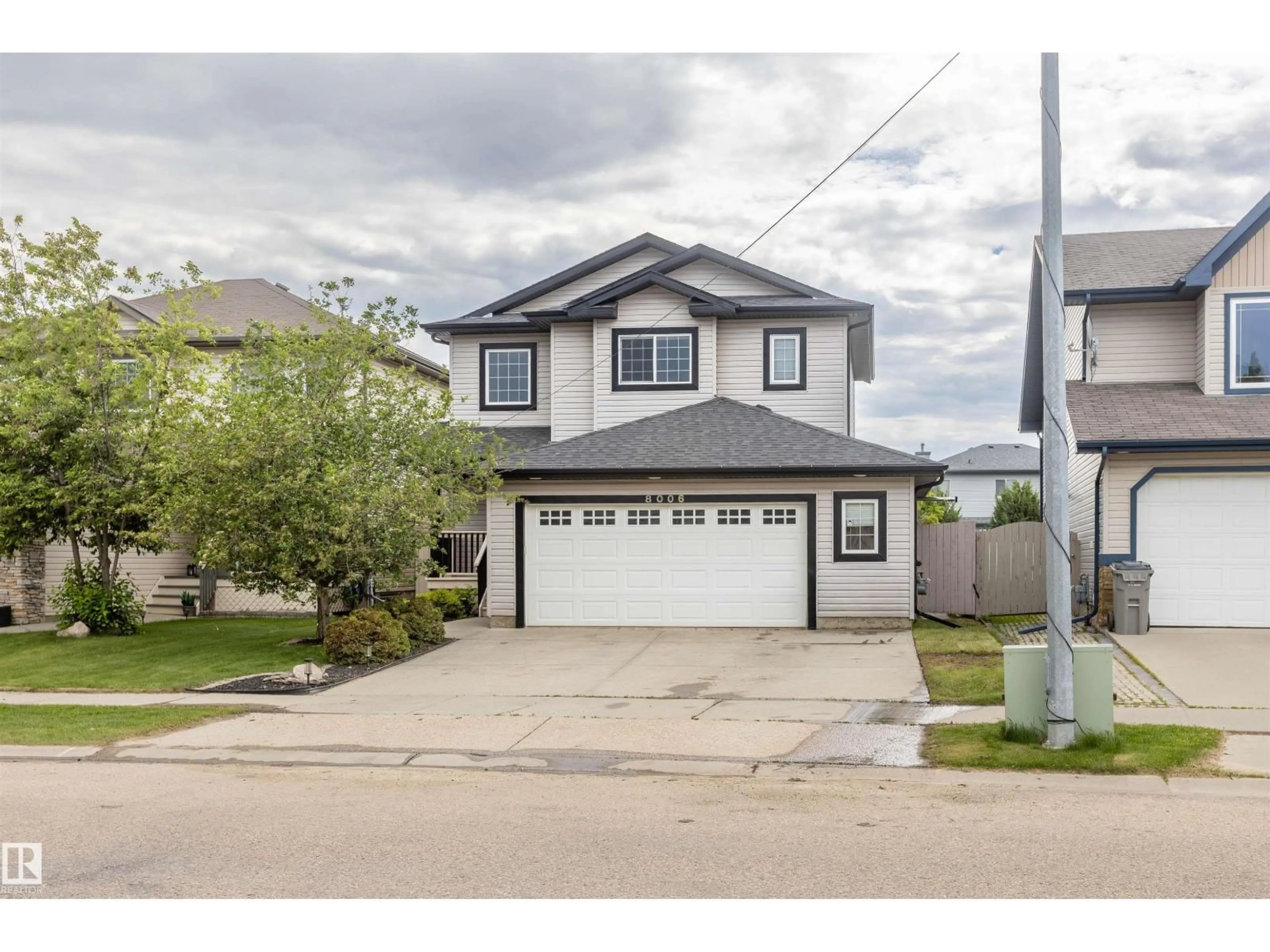 Home with vinyl exterior material, street for 8006 96 ST, Morinville Alberta T8R1W1