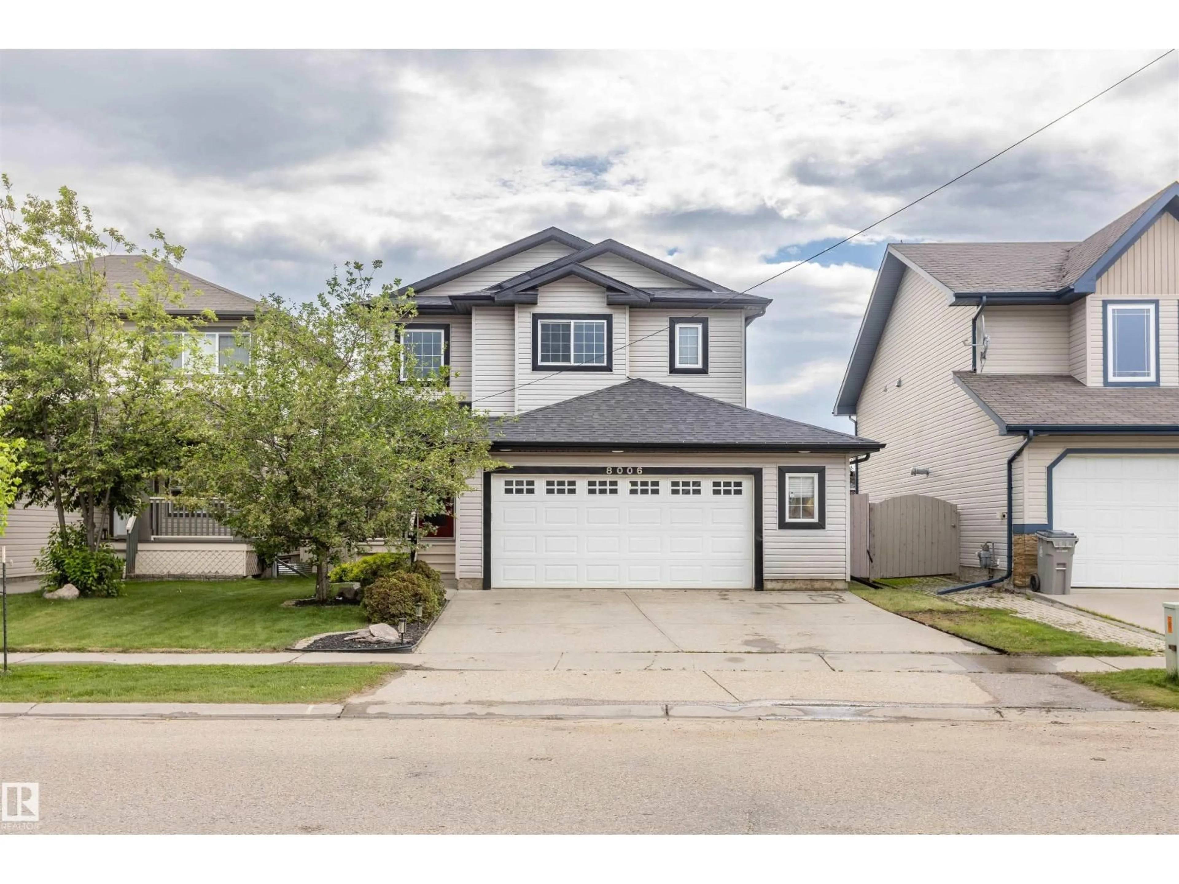 Home with vinyl exterior material, street for 8006 96 ST, Morinville Alberta T8R1W1