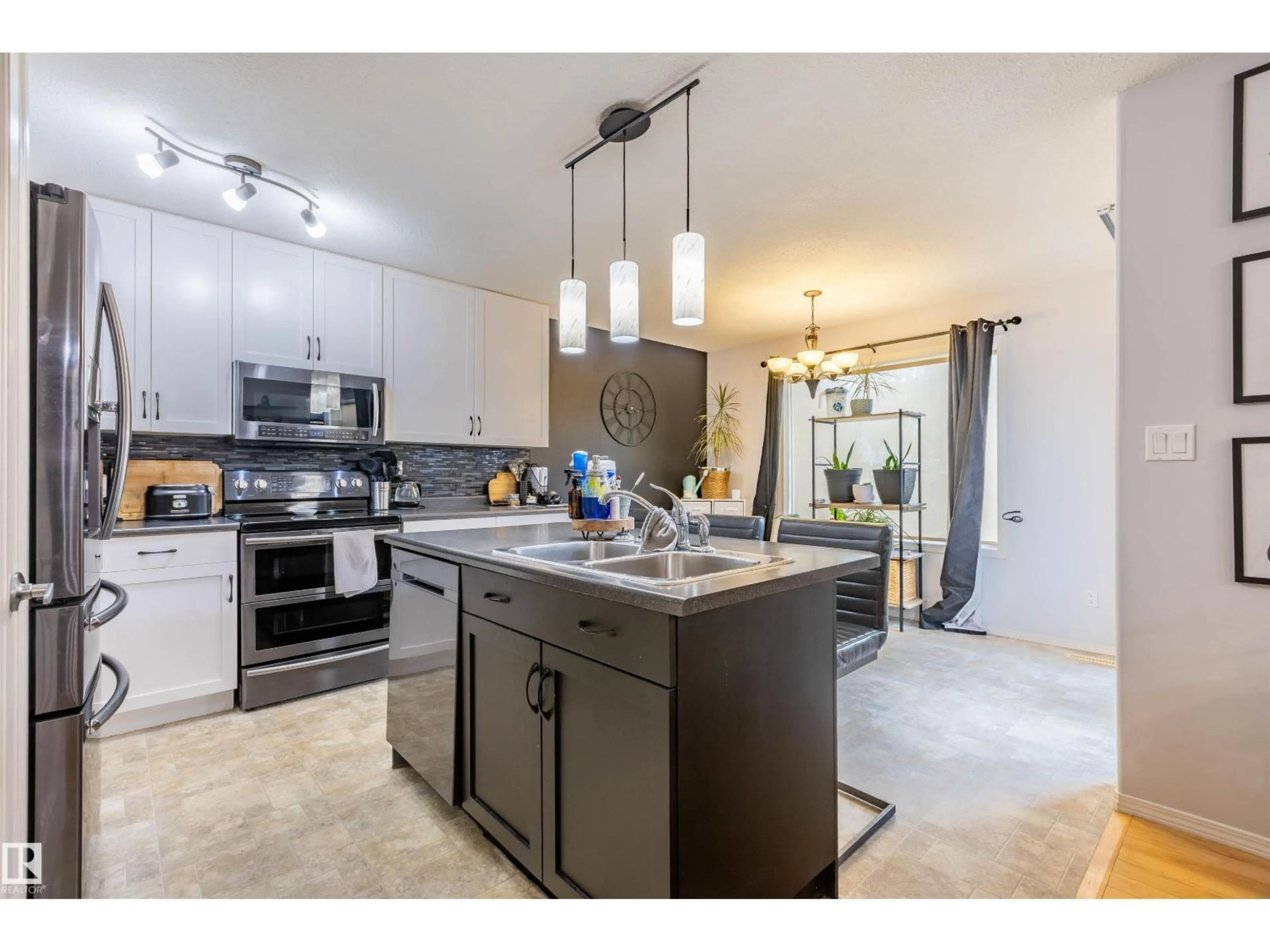 Open concept kitchen, ceramic/tile floor for 8006 96 ST, Morinville Alberta T8R1W1