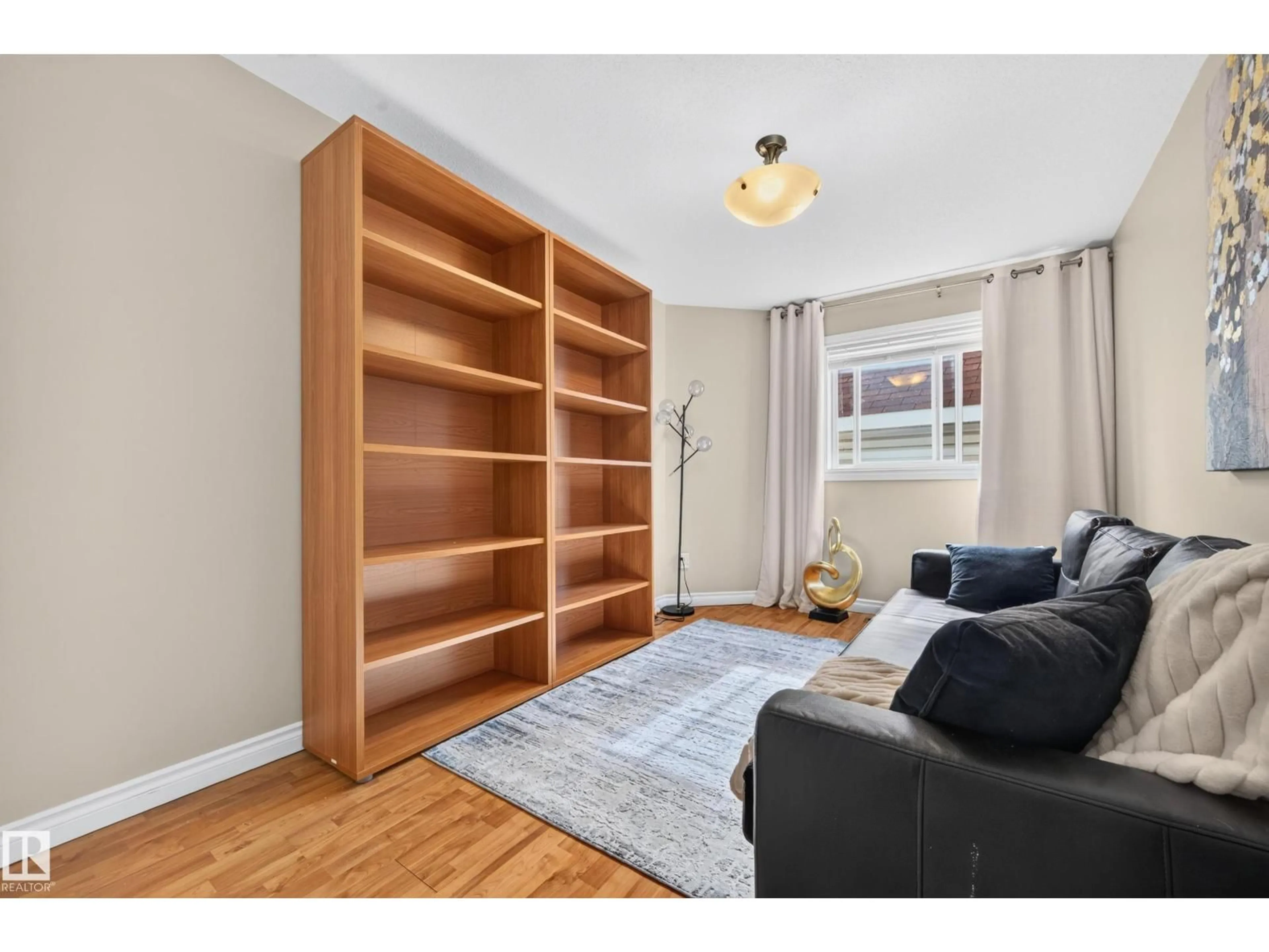Living room with furniture, wood/laminate floor for 325 CUTTS CO, Edmonton Alberta T6V1M7