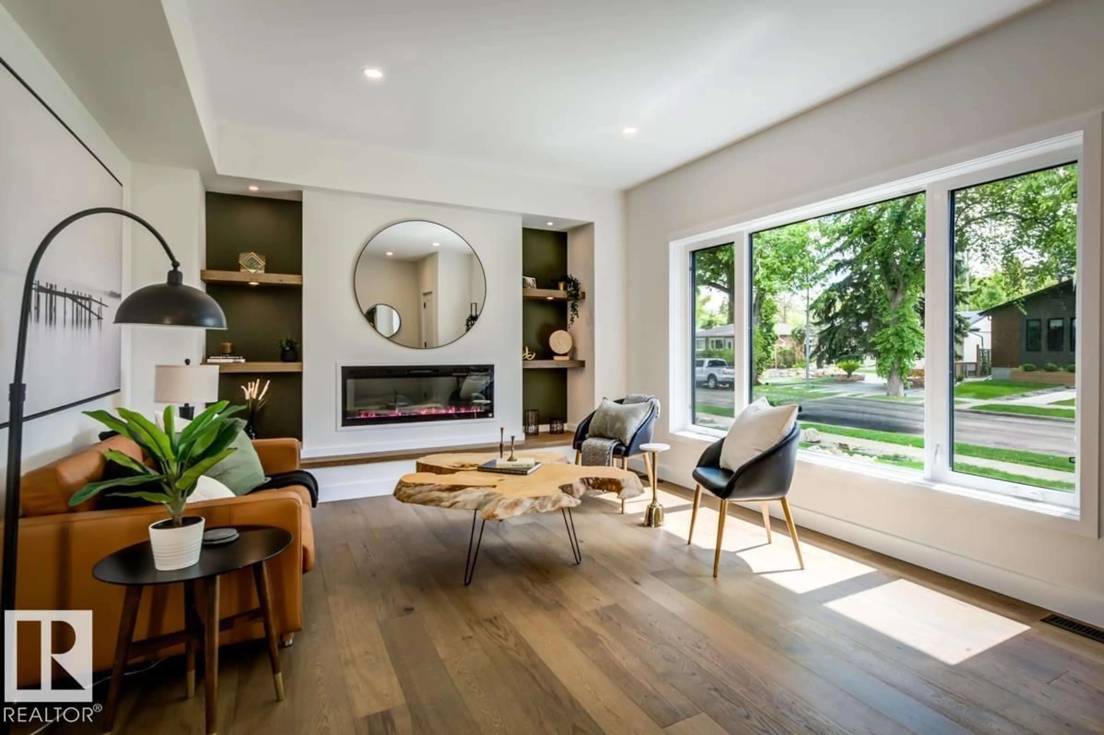 Living room with furniture, wood/laminate floor for 7924 92 AV, Edmonton Alberta T6C1R7