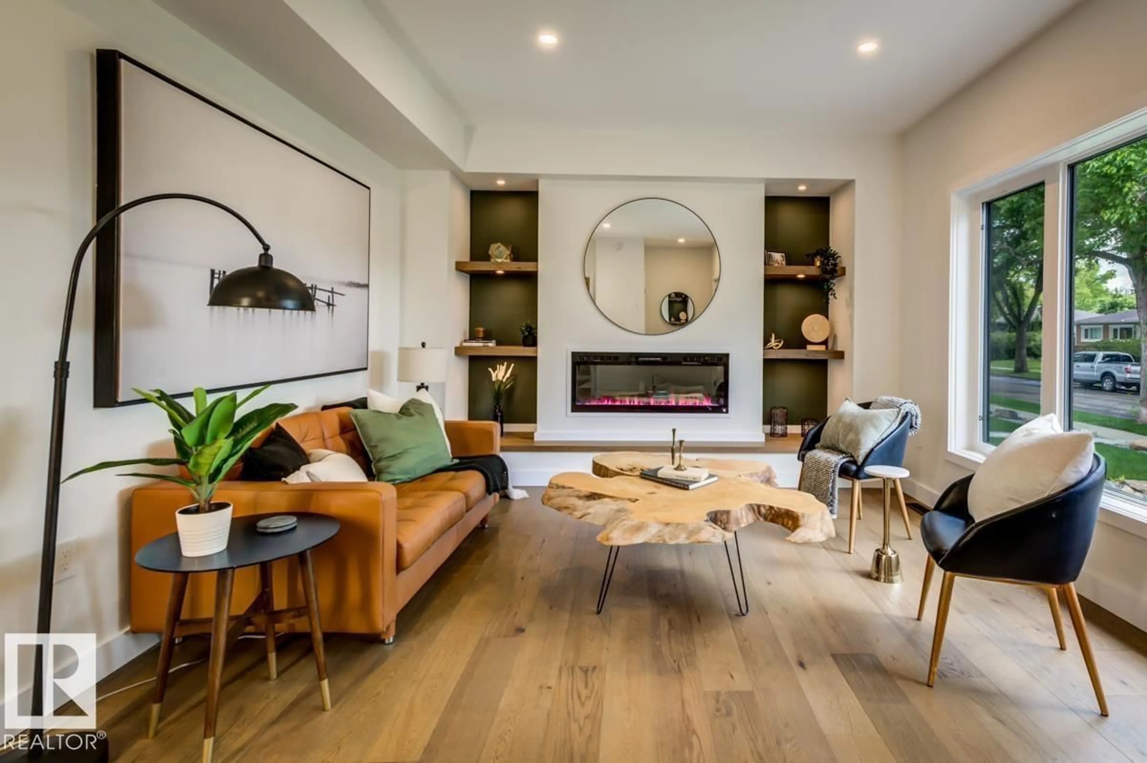 Living room with furniture, wood/laminate floor for 7924 92 AV, Edmonton Alberta T6C1R7