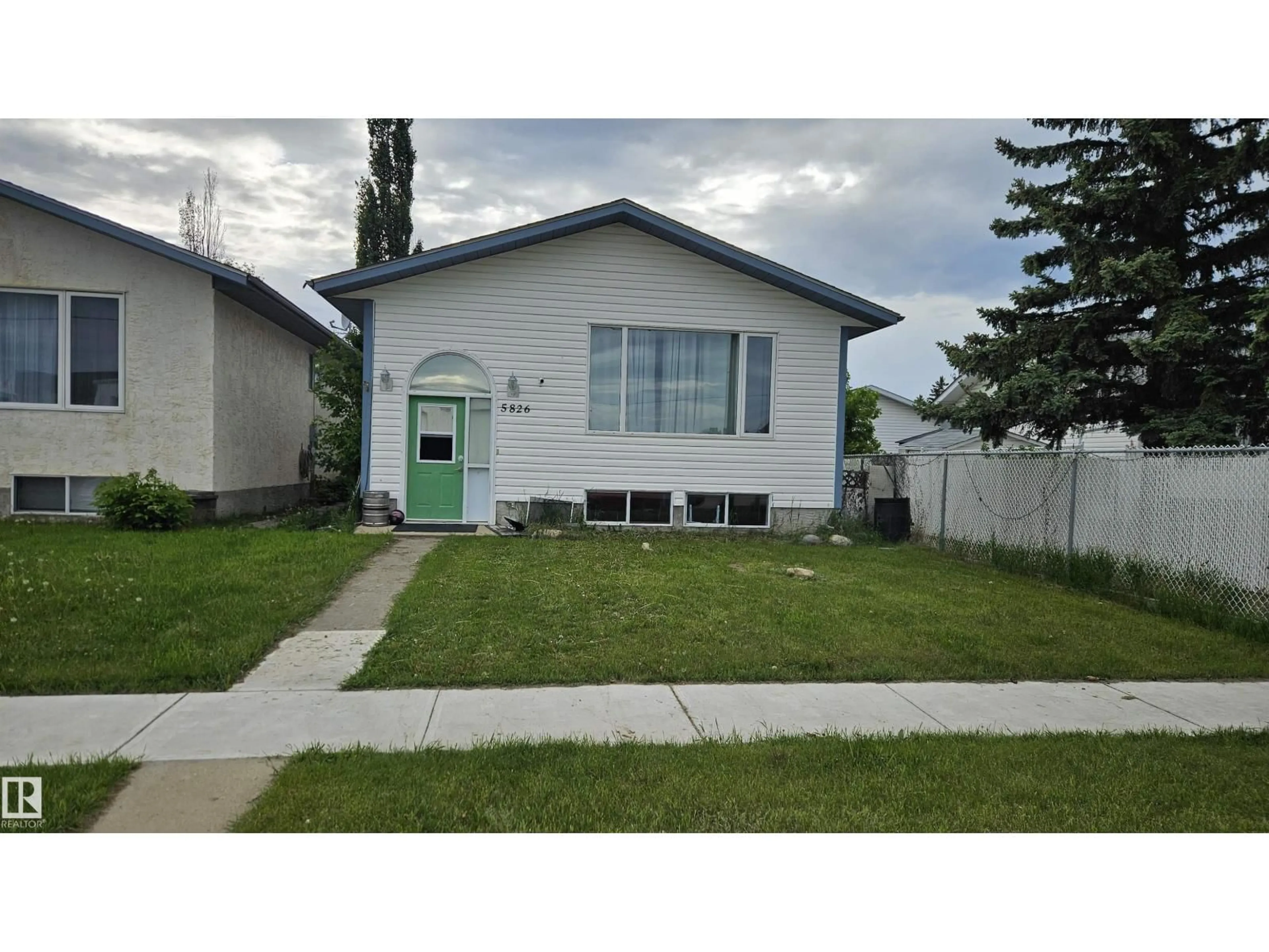 Home with vinyl exterior material, street for 5826 49 ST, Tofield Alberta T0B4J0