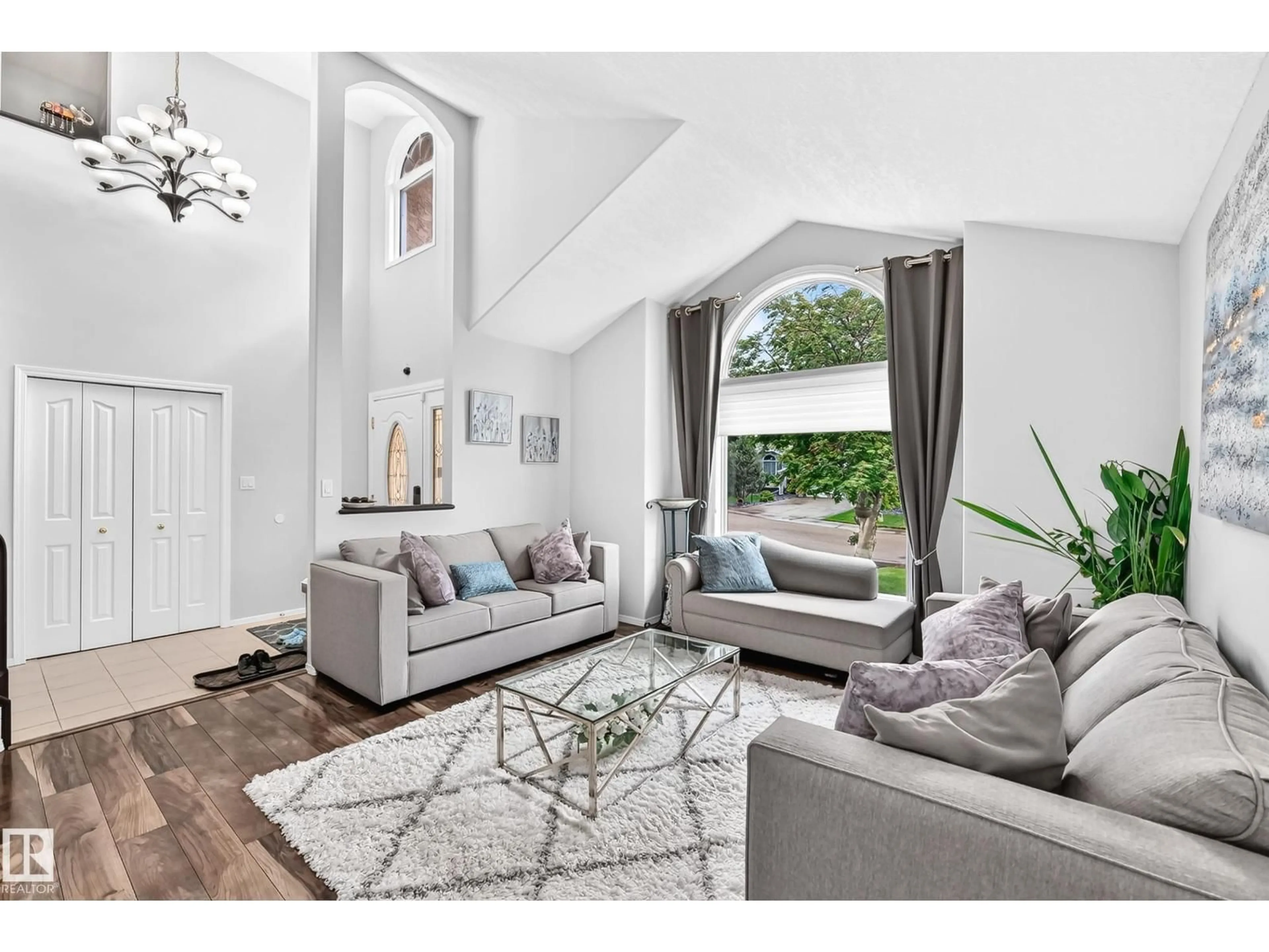 Living room with furniture, wood/laminate floor for 4216 47 ST, Edmonton Alberta T6L6J5