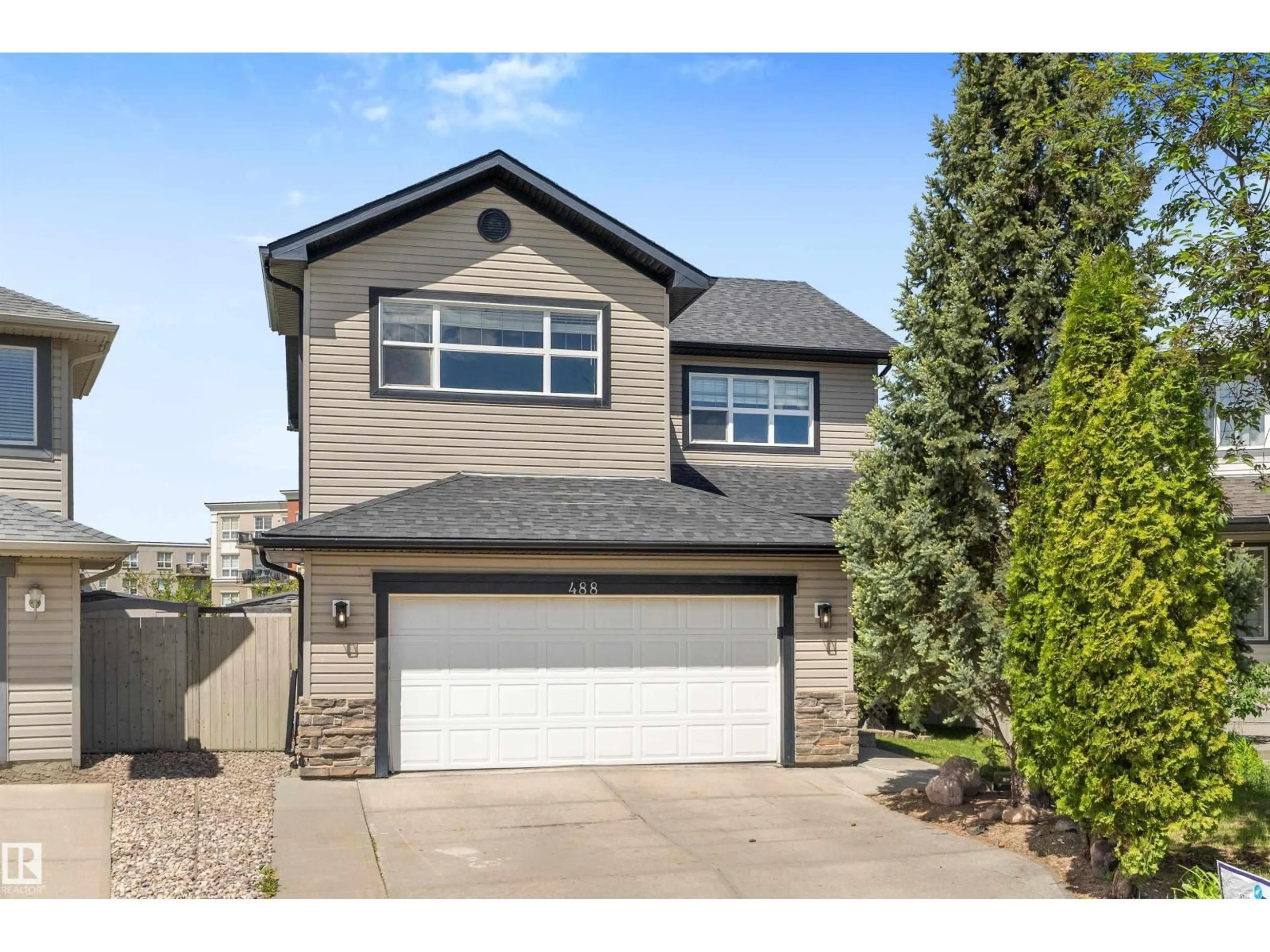 Home with vinyl exterior material, street for 488 MACEWAN RD, Edmonton Alberta T6W1P9