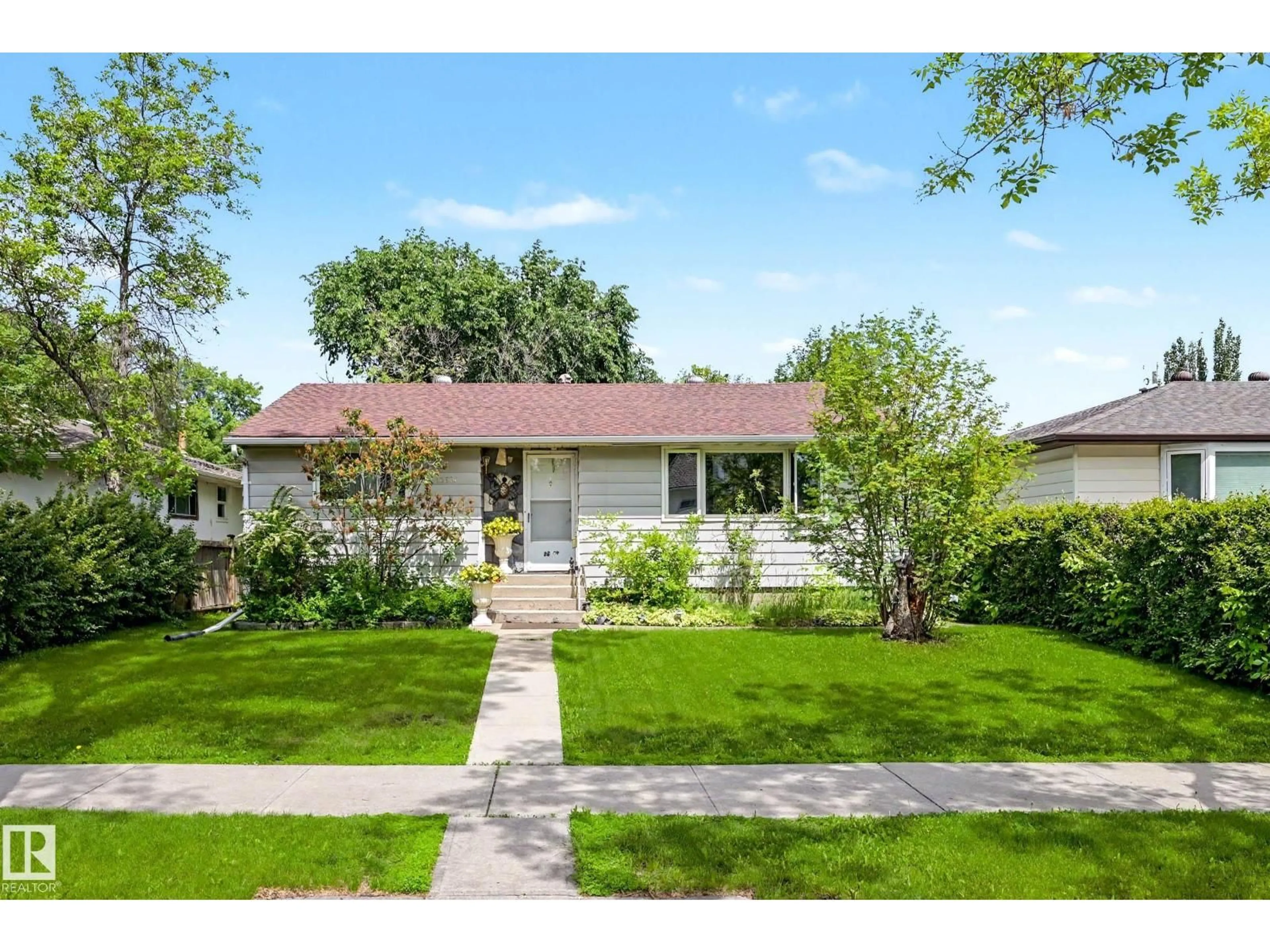 Home with vinyl exterior material, street for 13636 122 AVE, Edmonton Alberta T5L2V8