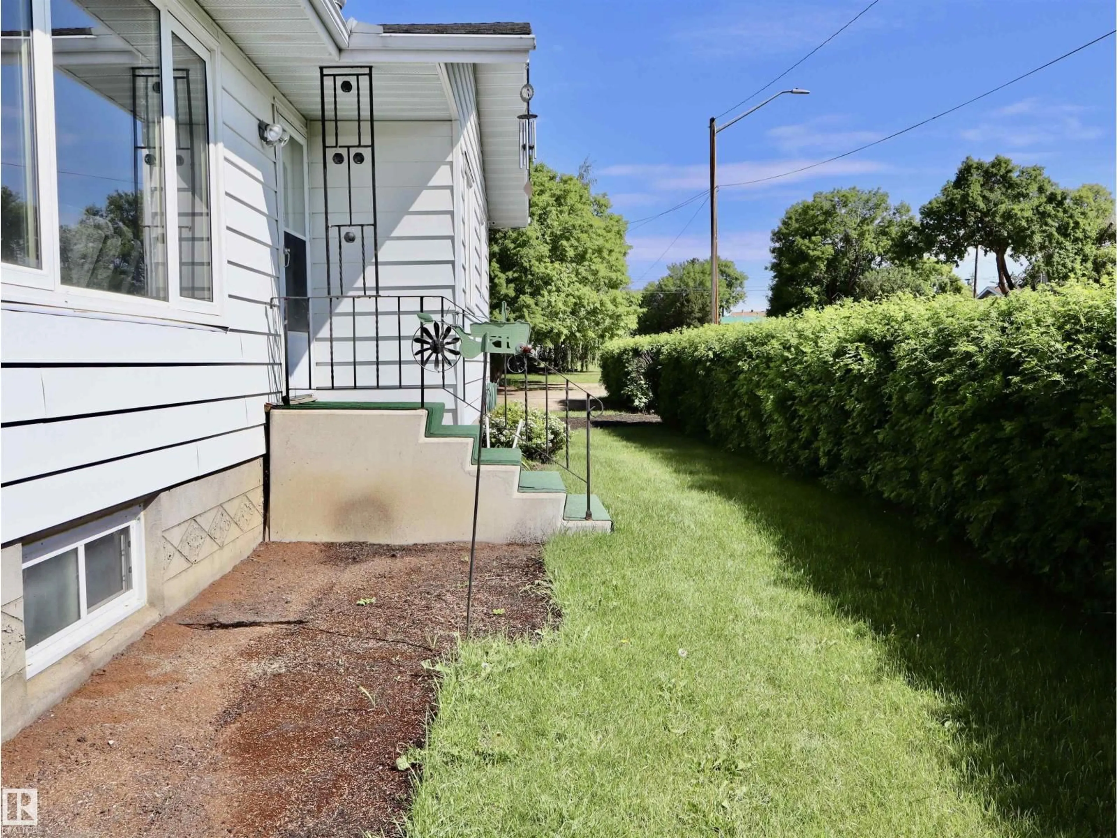 A pic from outside/outdoor area/front of a property/back of a property/a pic from drone, street for 5530 46 STREET, Barrhead Alberta T7N1K6
