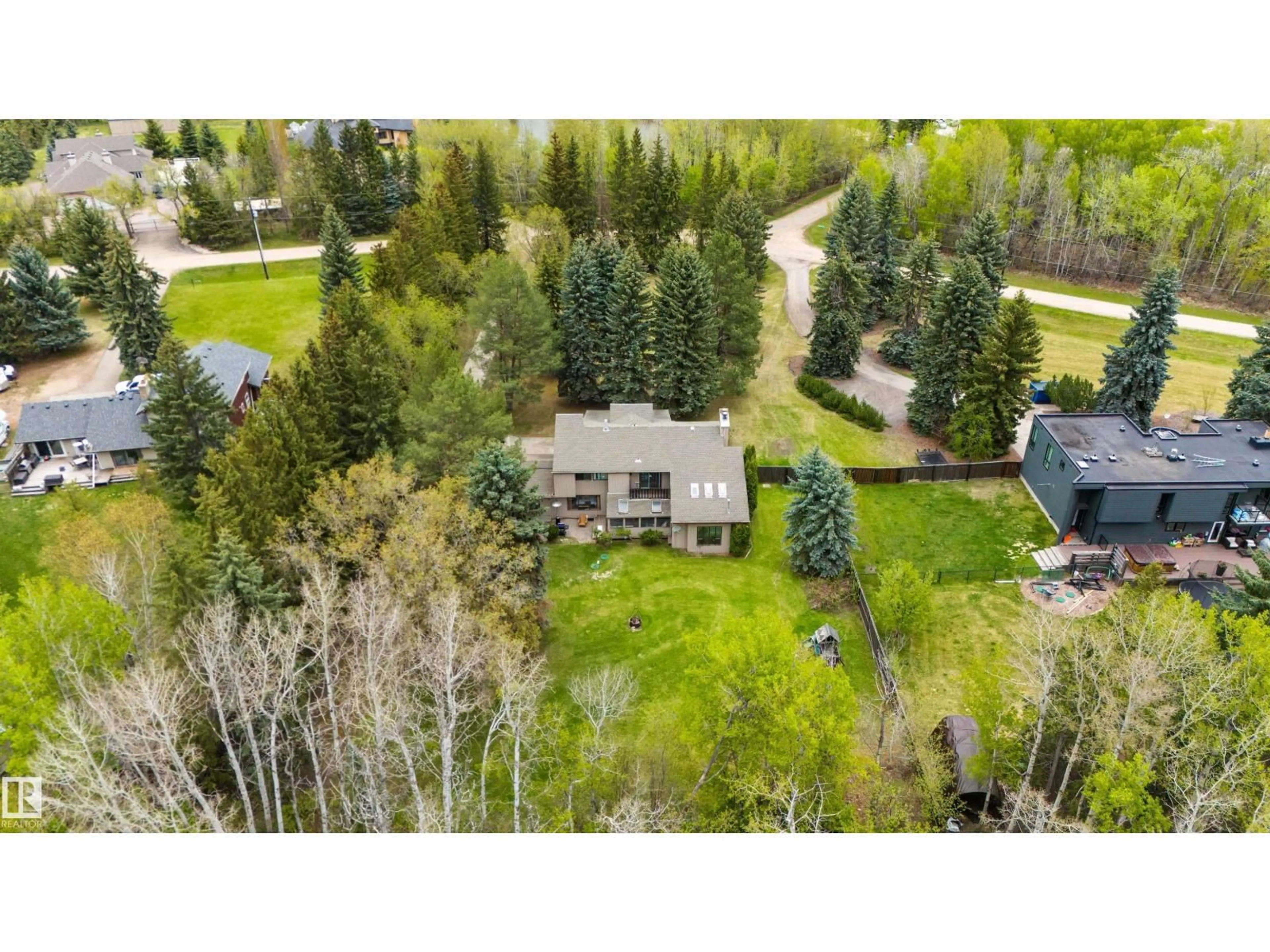 A pic from outside/outdoor area/front of a property/back of a property/a pic from drone, forest/trees view for SW - 20515 5 AV, Edmonton Alberta T6M2P4