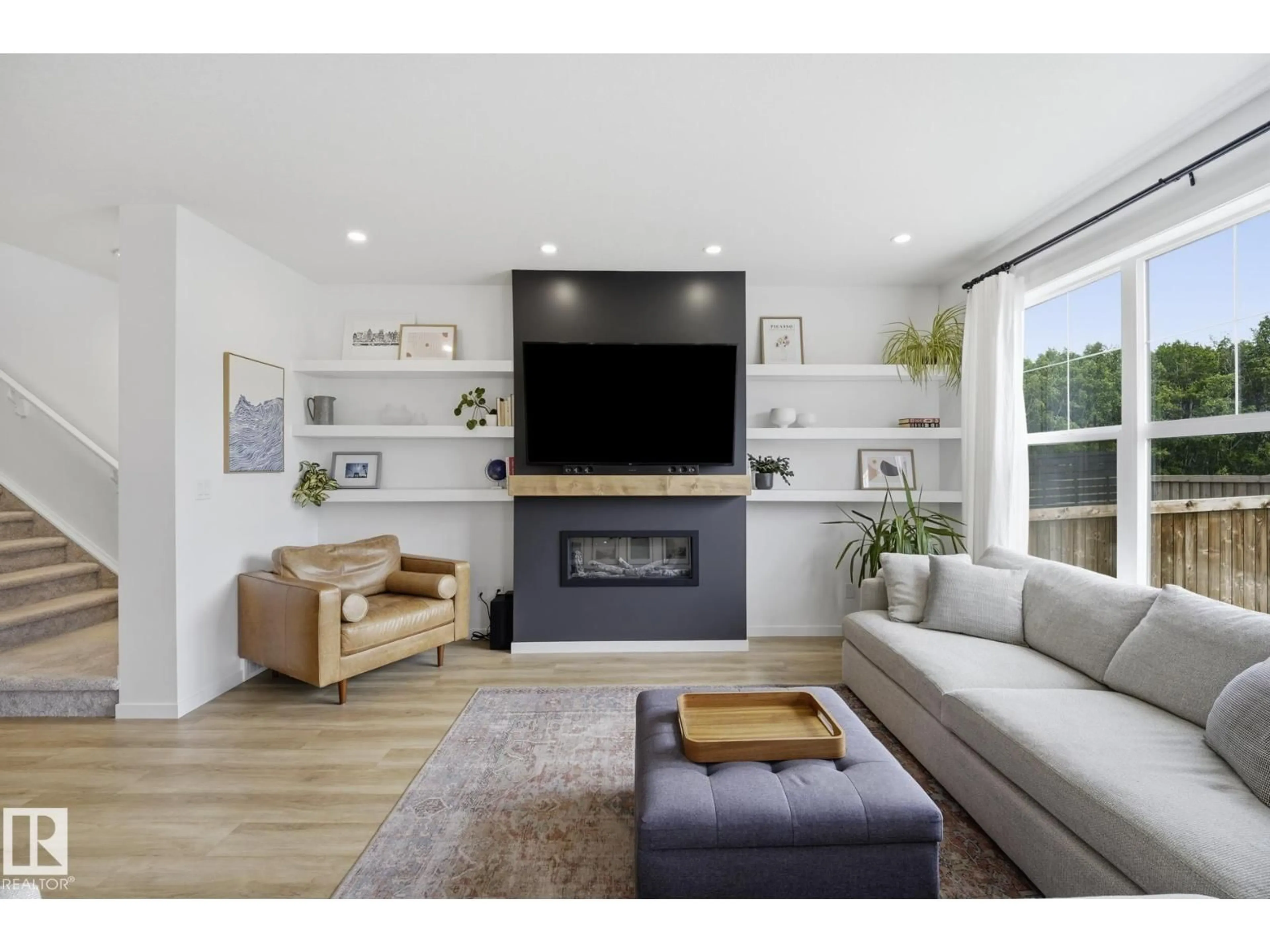 Living room with furniture, wood/laminate floor for 21845 98A AV, Edmonton Alberta T5T7J3