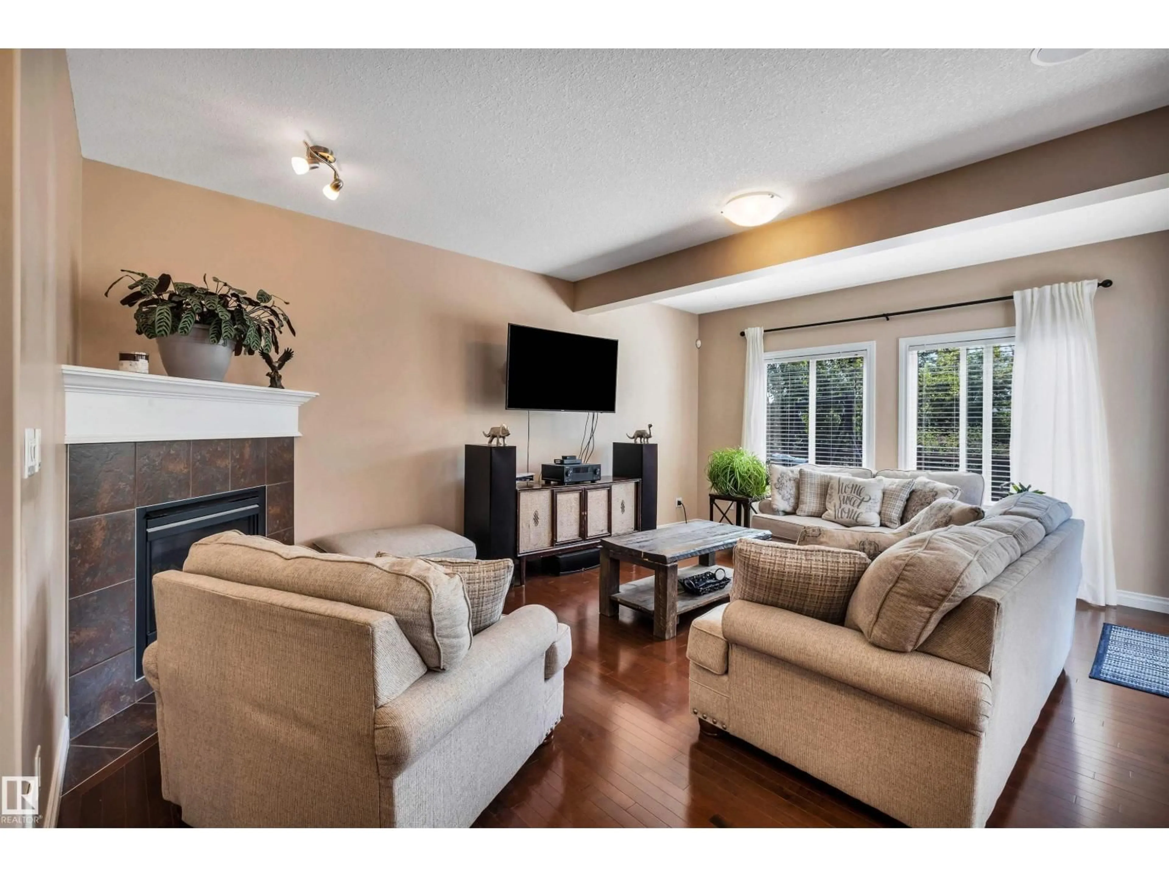 Living room with furniture, wood/laminate floor for 18 VOLETA CT, Spruce Grove Alberta T7X0J8