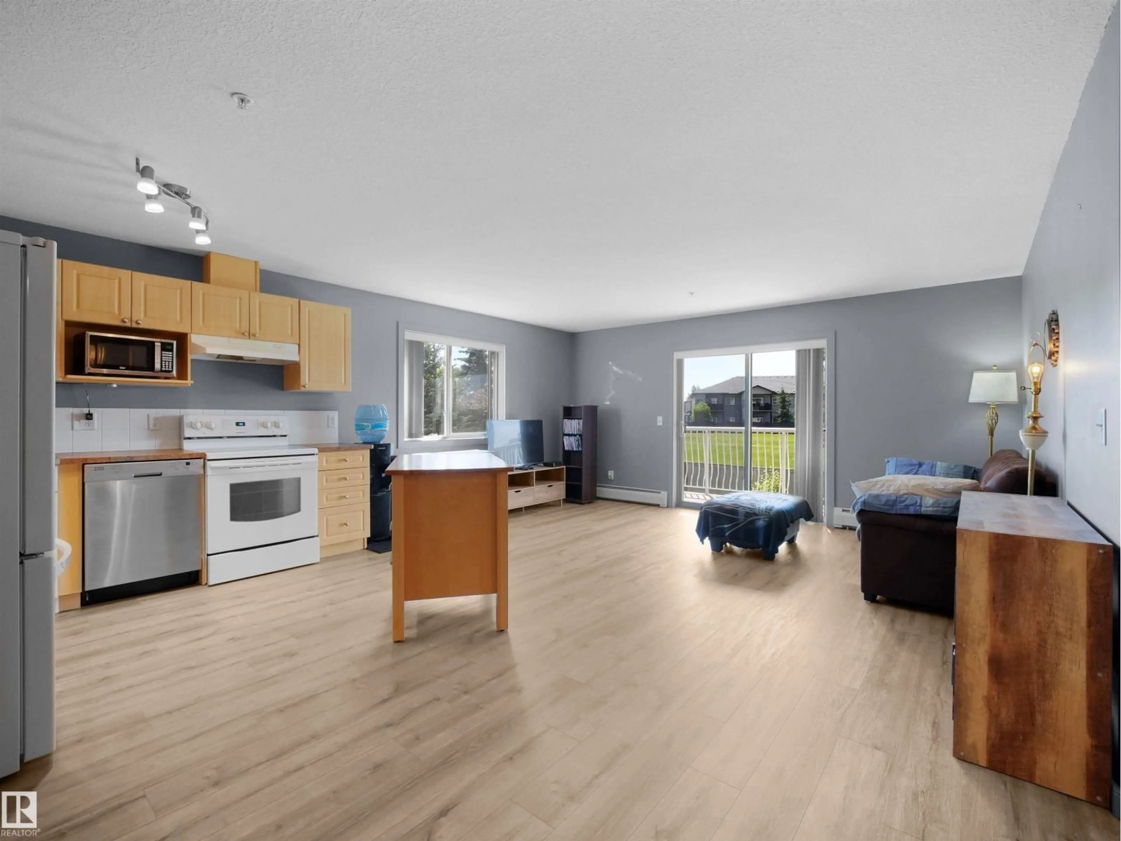 Open concept kitchen, wood/laminate floor for #217 - 240 SPRUCE RIDGE RD, Spruce Grove Alberta T7X0G5