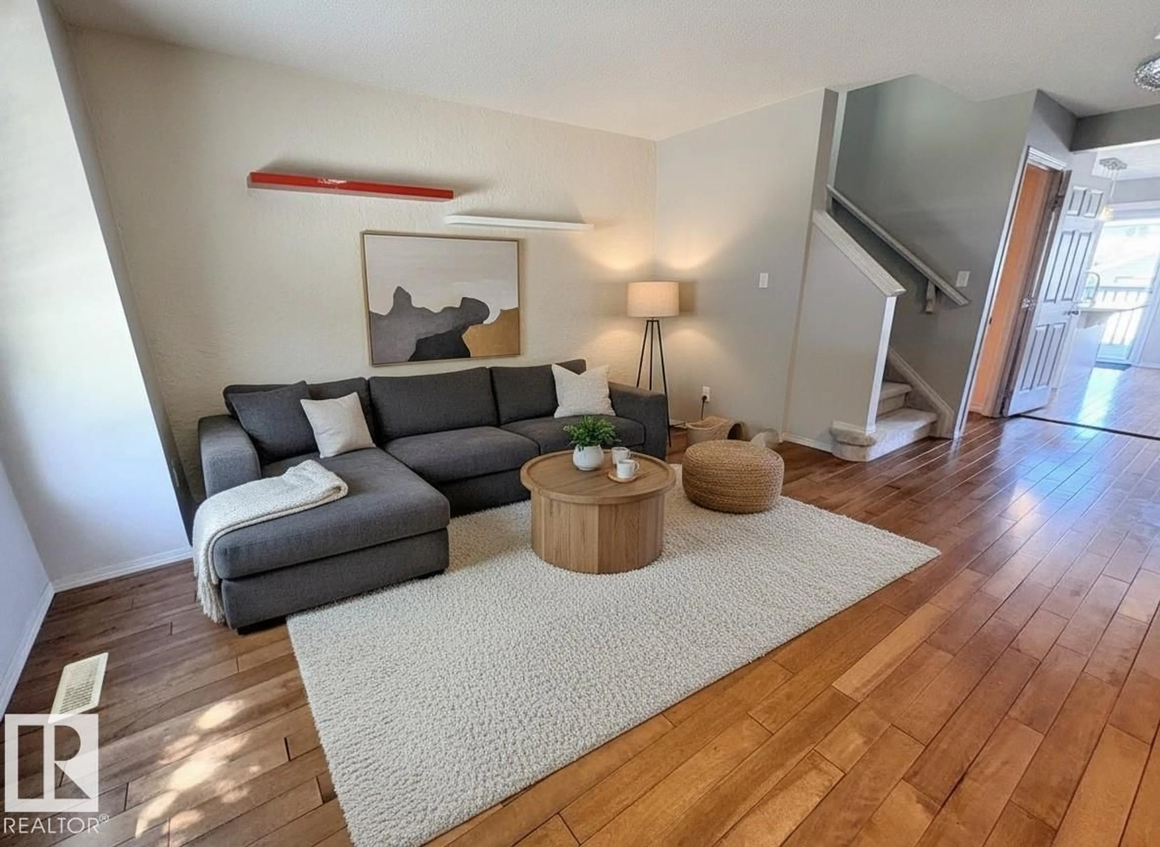 Living room with furniture, wood/laminate floor for 21354 87A AV, Edmonton Alberta T5T6T8