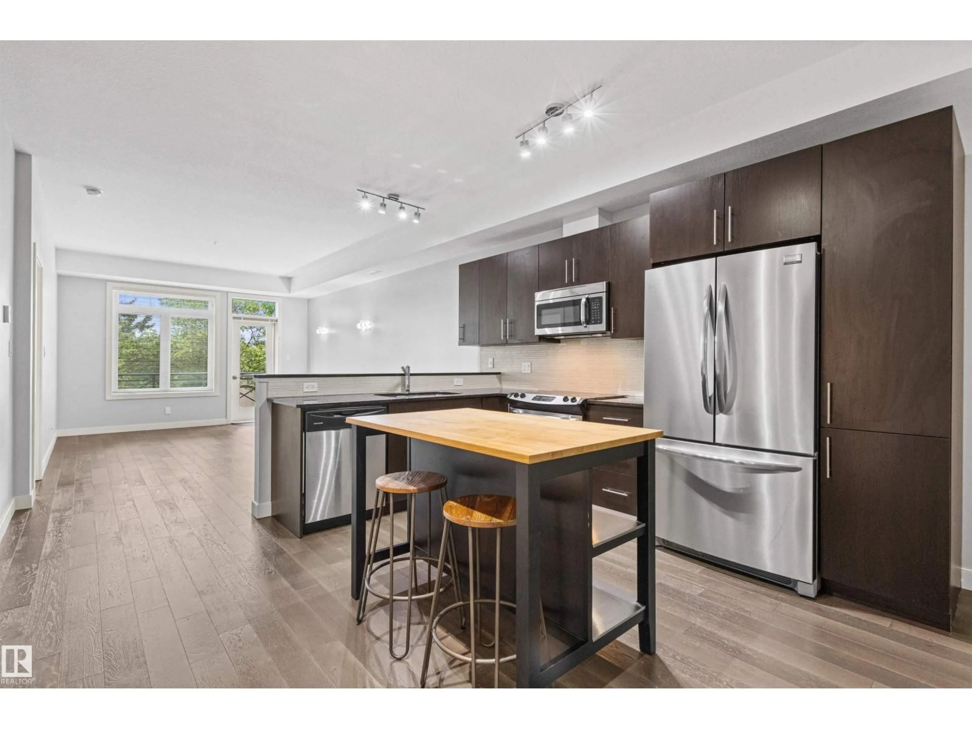 Open concept kitchen, wood/laminate floor for #318 - 10811 72 AV, Edmonton Alberta T6E1A4