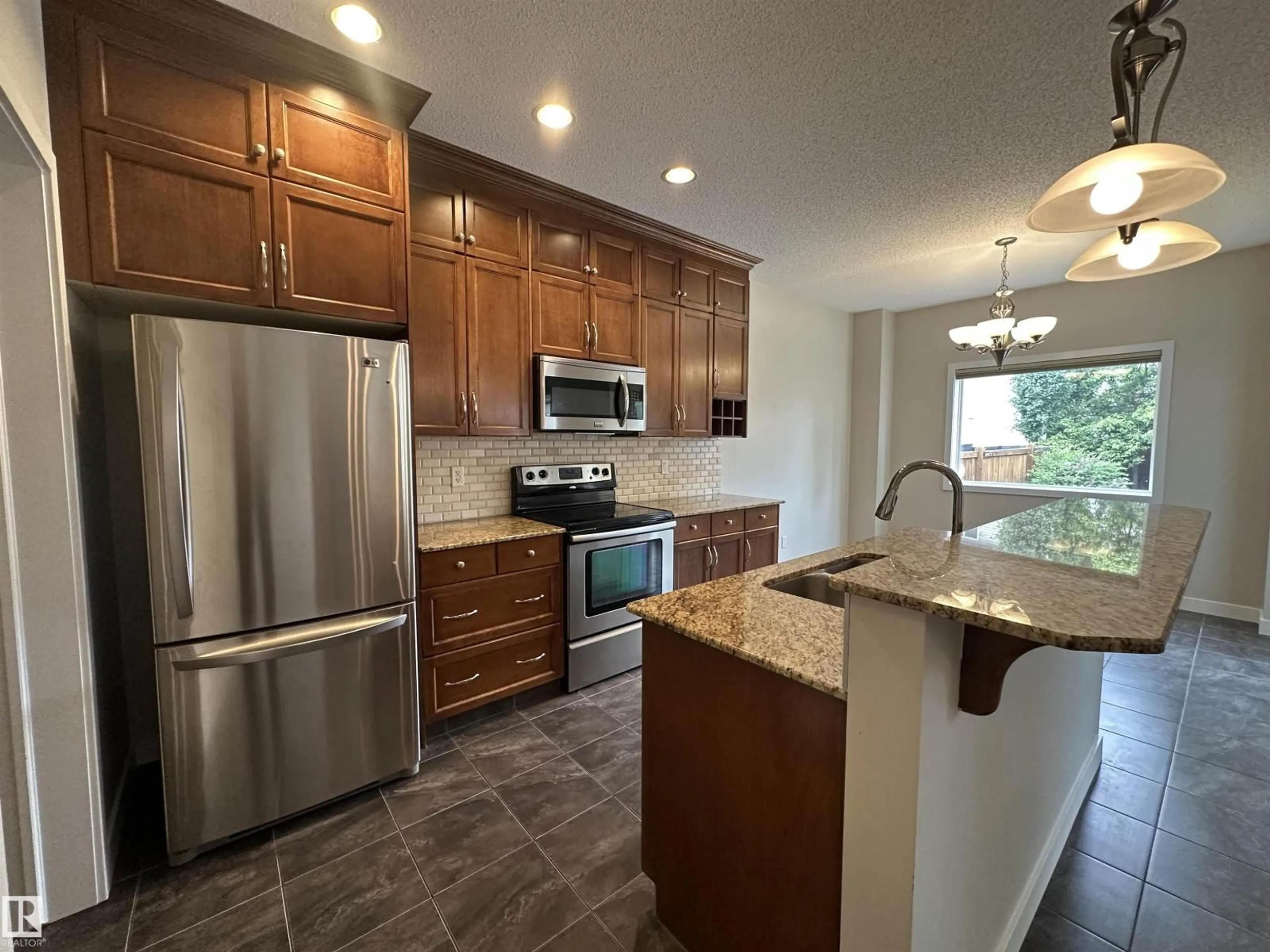 Open concept kitchen, ceramic/tile floor for 22060 95 AV, Edmonton Alberta T6T4A7