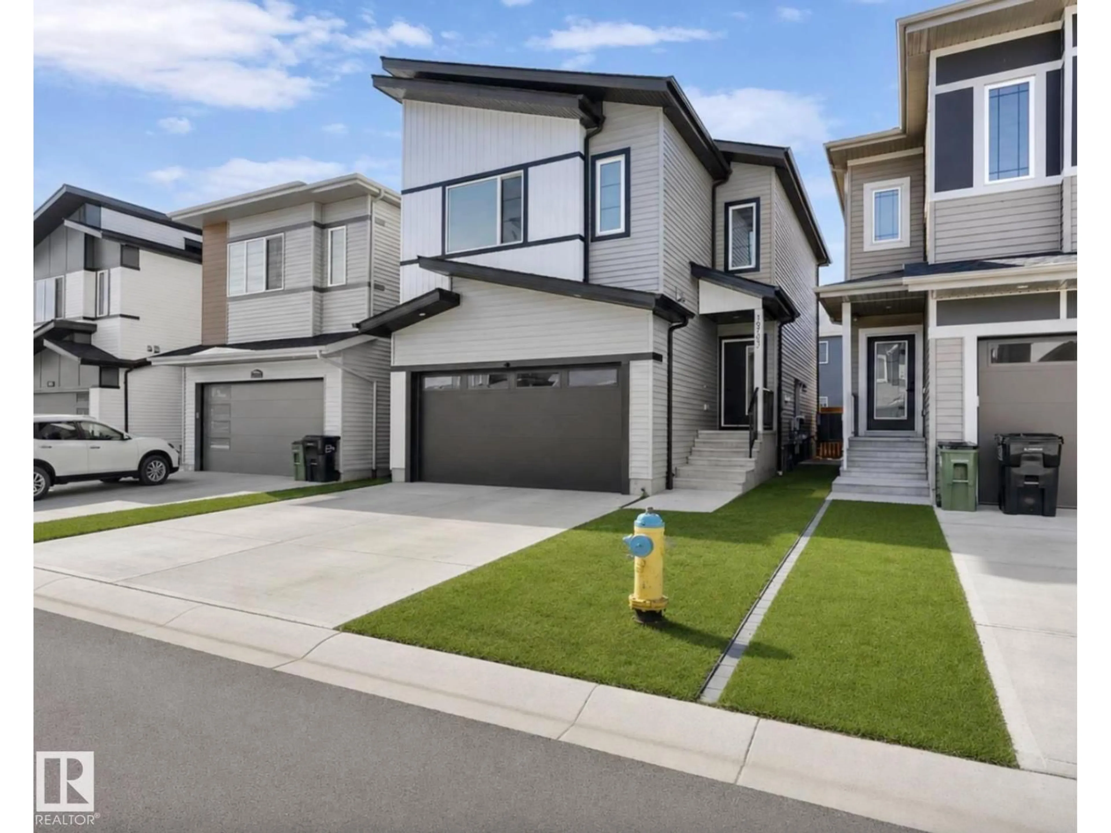 Home with vinyl exterior material, street for 19703 29 AVENUE AVENUE, Edmonton Alberta T6M1M2