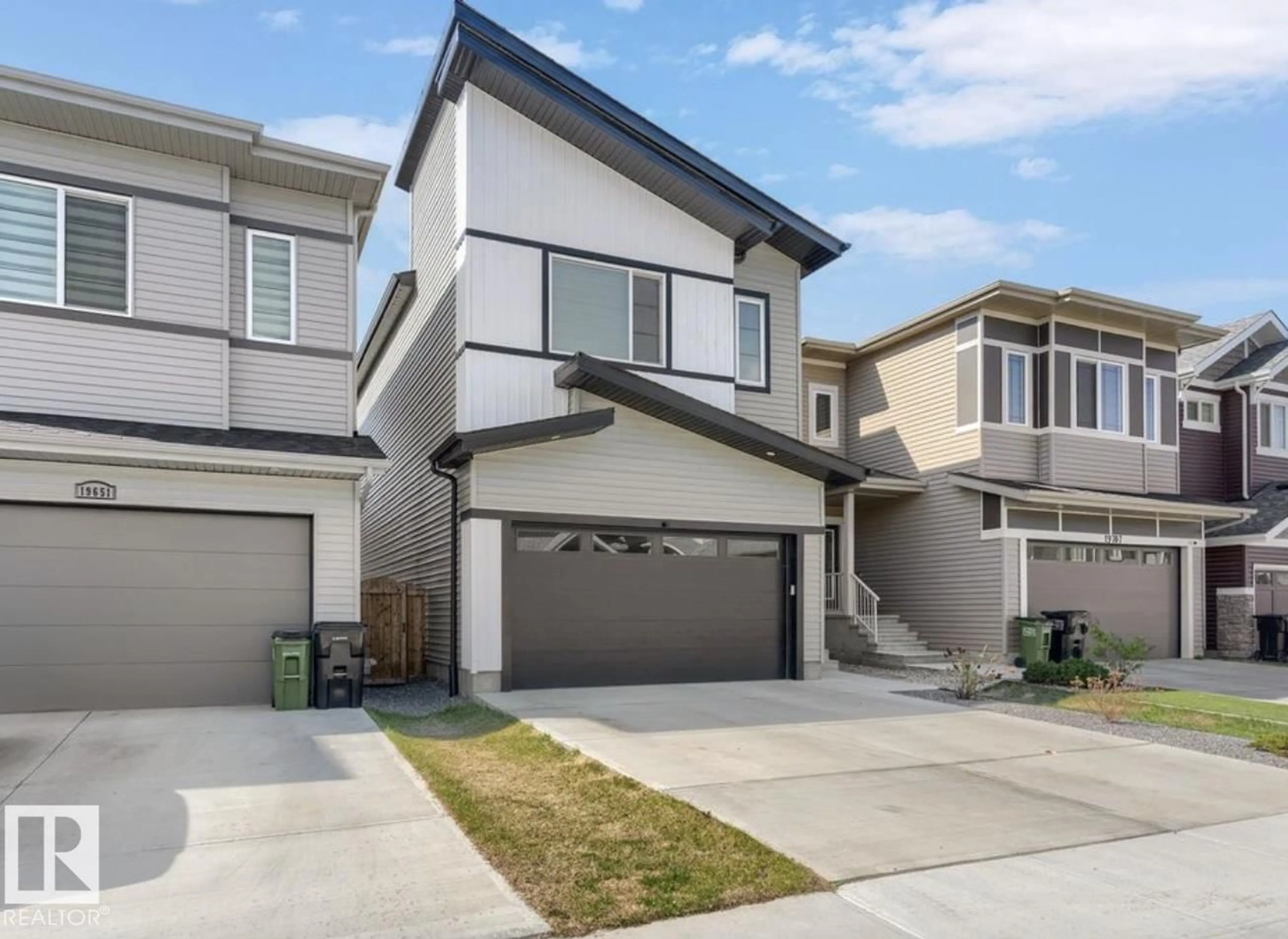 Home with vinyl exterior material, street for 19703 29 AVENUE AVENUE, Edmonton Alberta T6M1M2