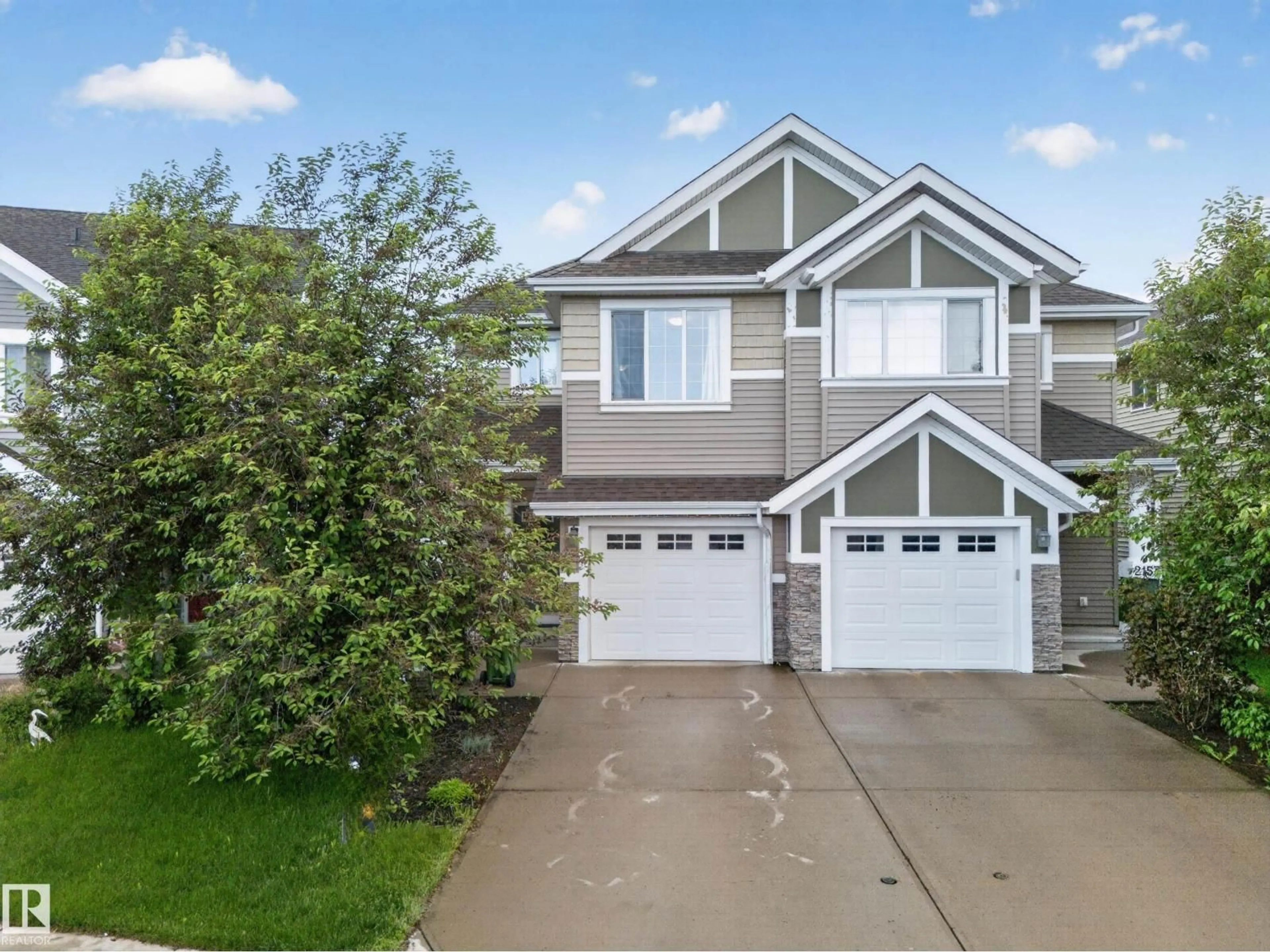 Home with vinyl exterior material, street for 2155 67 ST, Edmonton Alberta T6X0T5