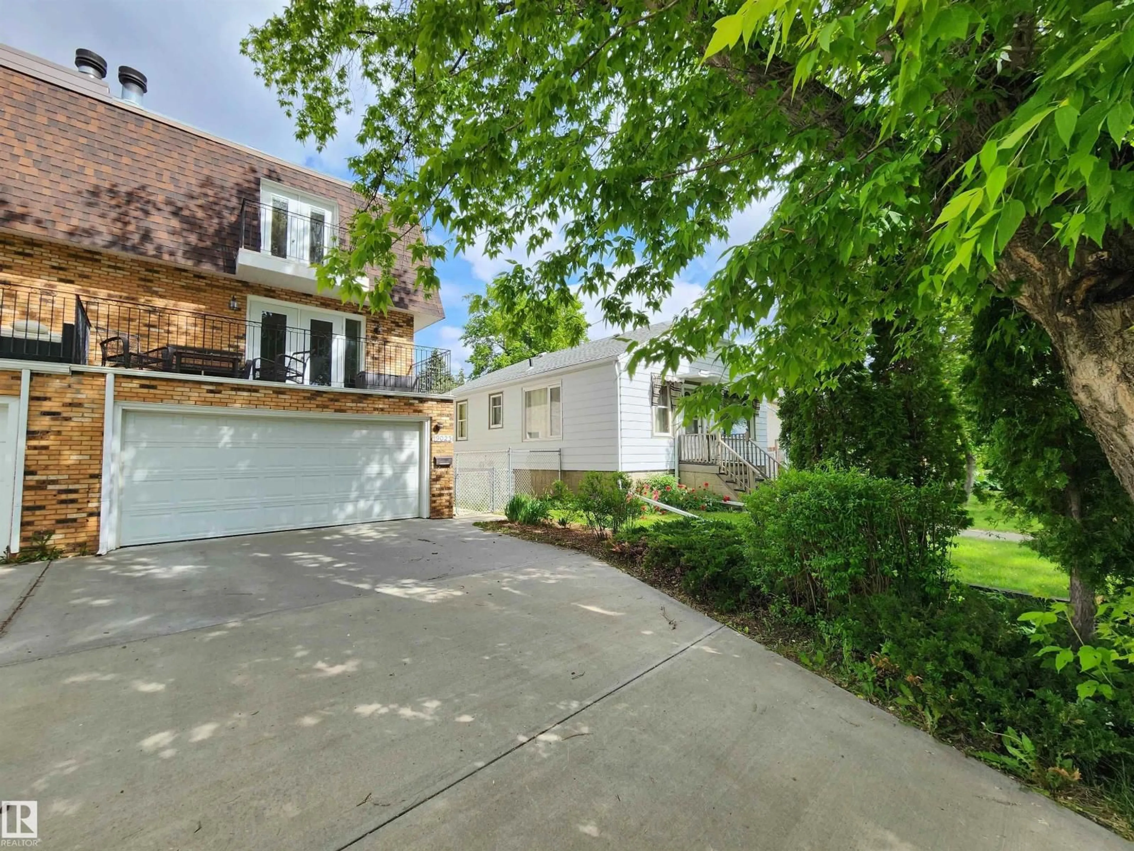 A pic from outside/outdoor area/front of a property/back of a property/a pic from drone, street for 9023 95 ST, Edmonton Alberta T6C3W7
