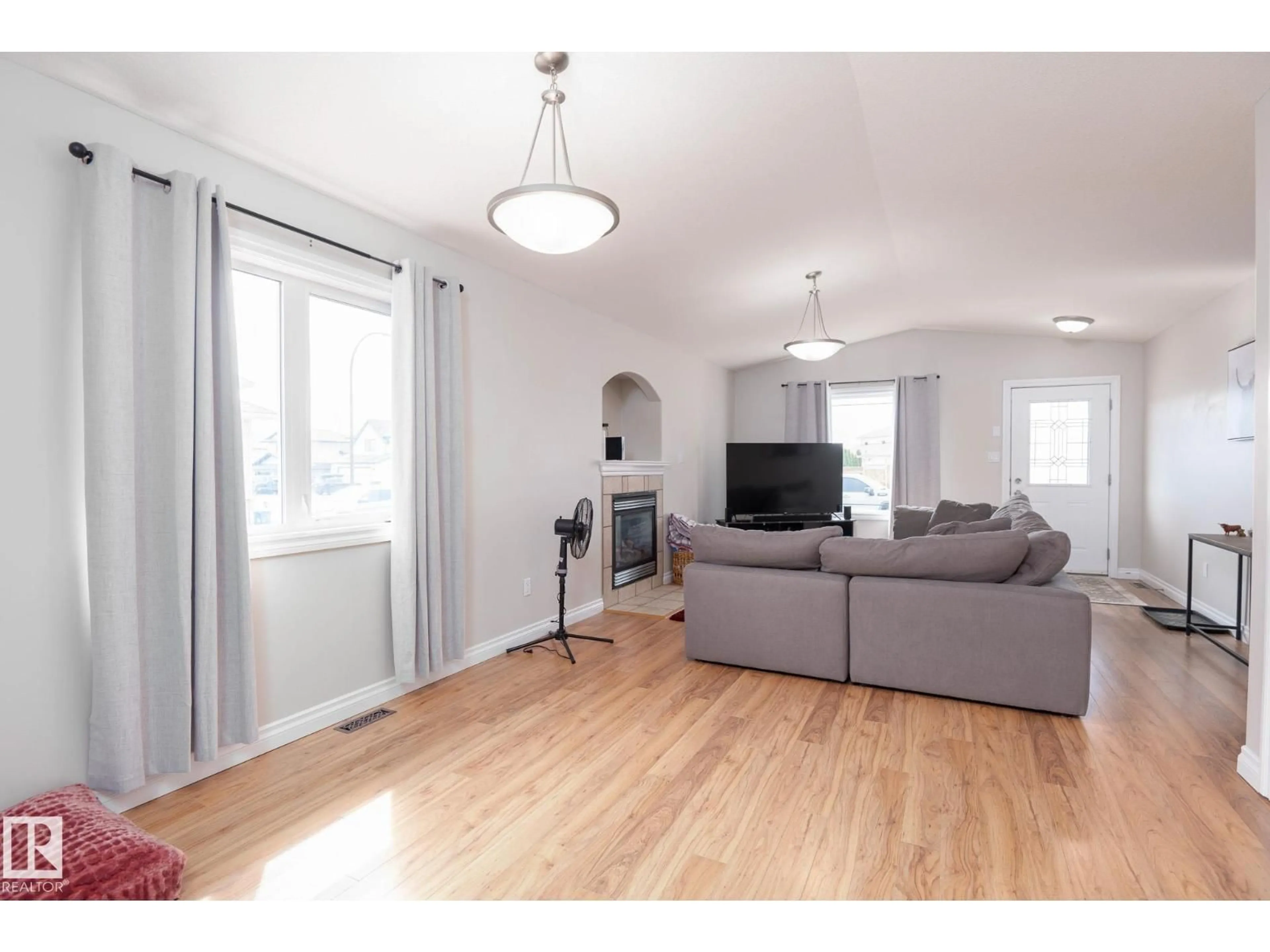 Living room with furniture, wood/laminate floor for 2620 LAKE AV, Cold Lake Alberta T9M0A1