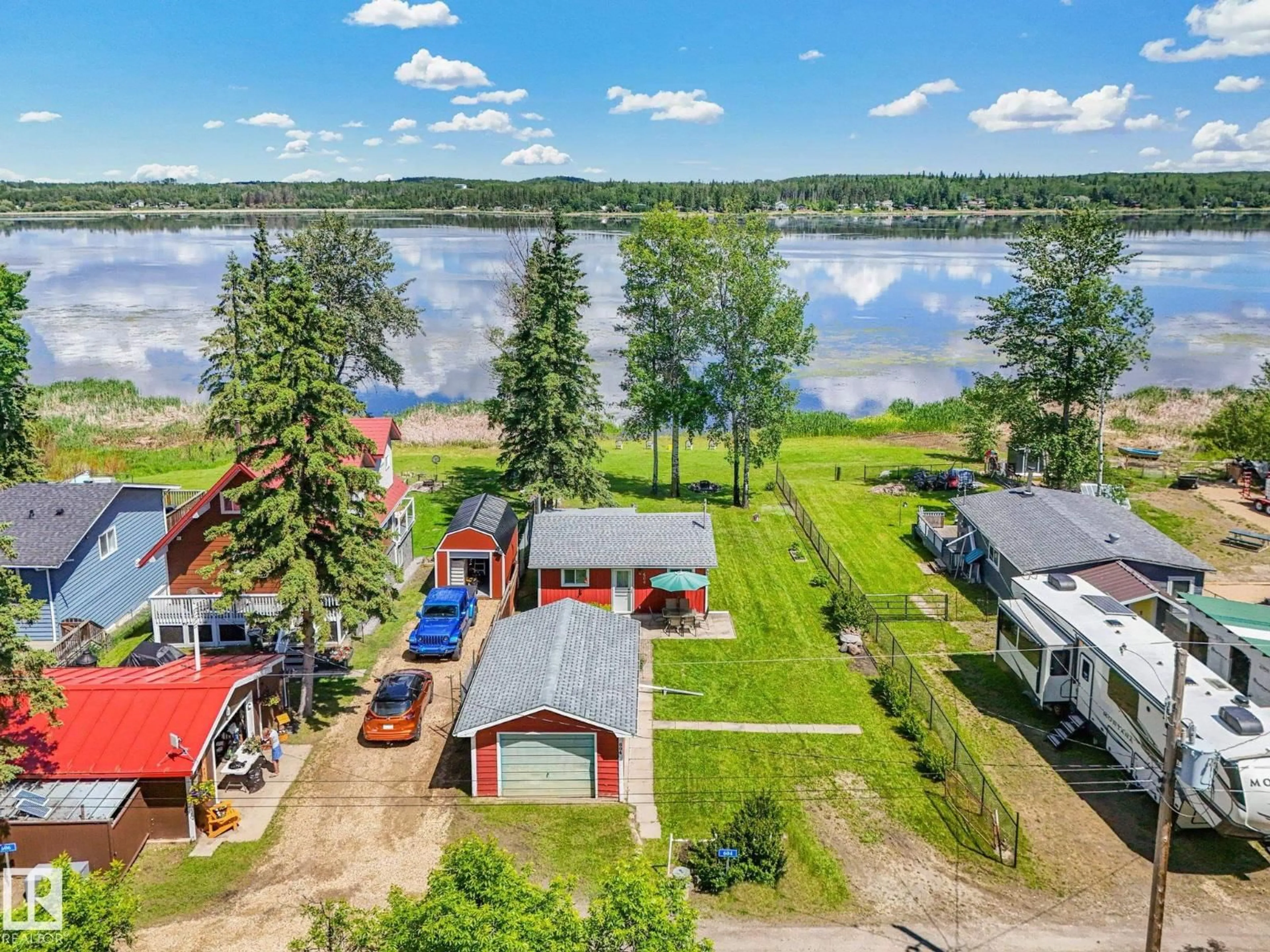 A pic from outside/outdoor area/front of a property/back of a property/a pic from drone, water/lake/river/ocean view for 604 BLUE HERON DRIVE, Rural Lac Ste. Anne County Alberta T0E1V0