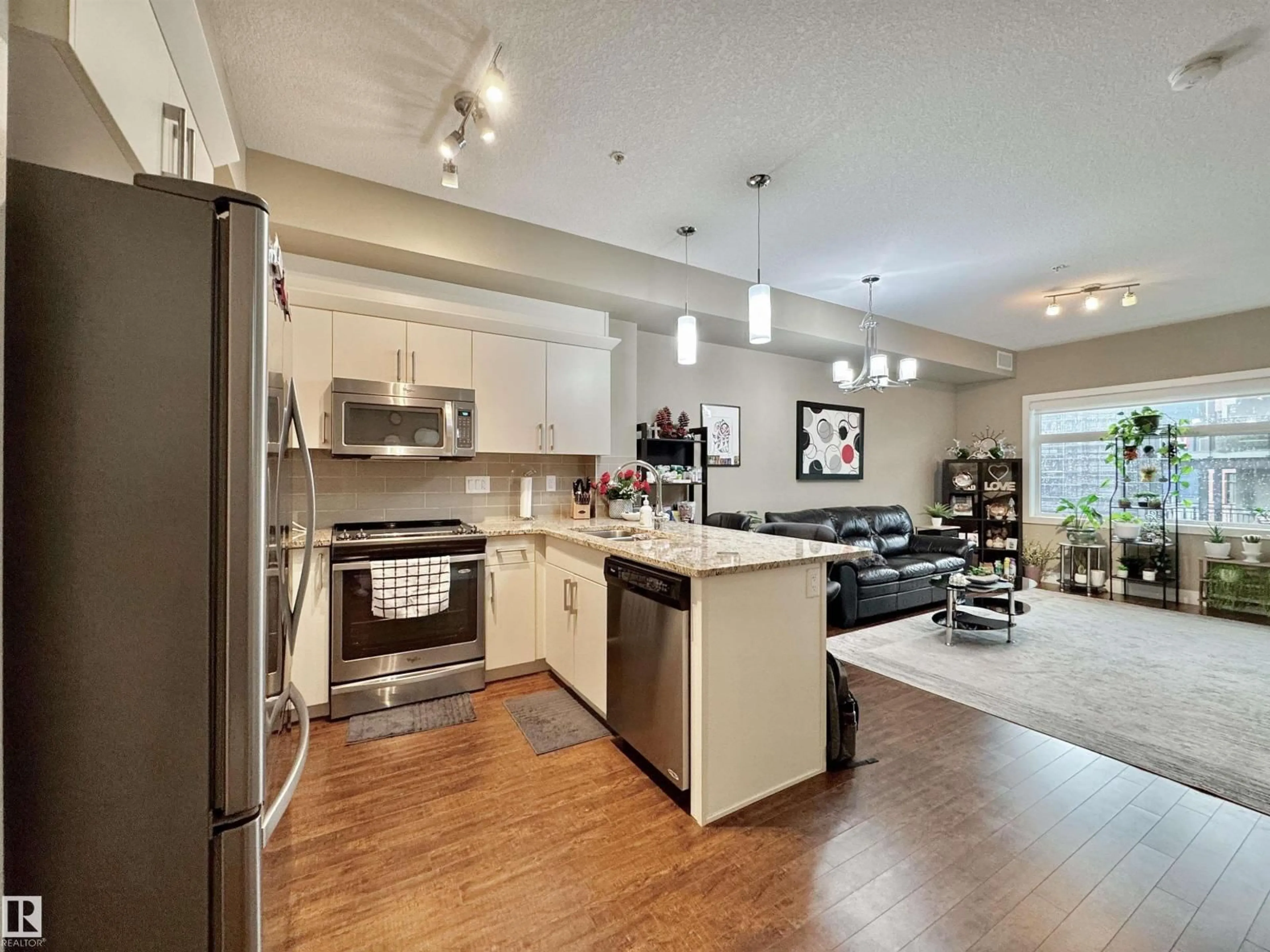 Open concept kitchen, wood/laminate floor for #303 - 111 FESTIVAL WY, Sherwood Park Alberta T8A4Y4