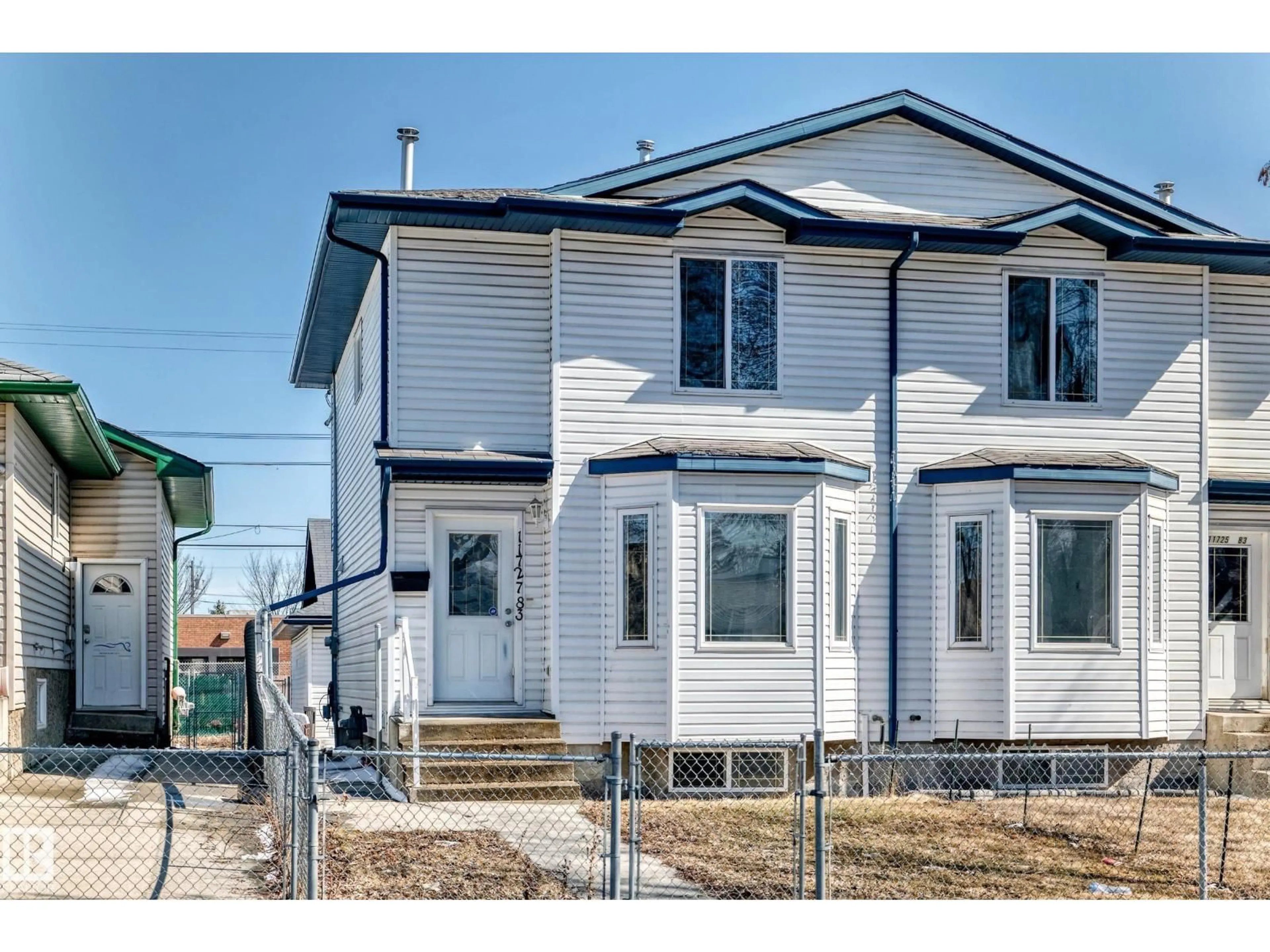 Home with vinyl exterior material, street for 11727 83 ST NW, Edmonton Alberta T5B2Z1