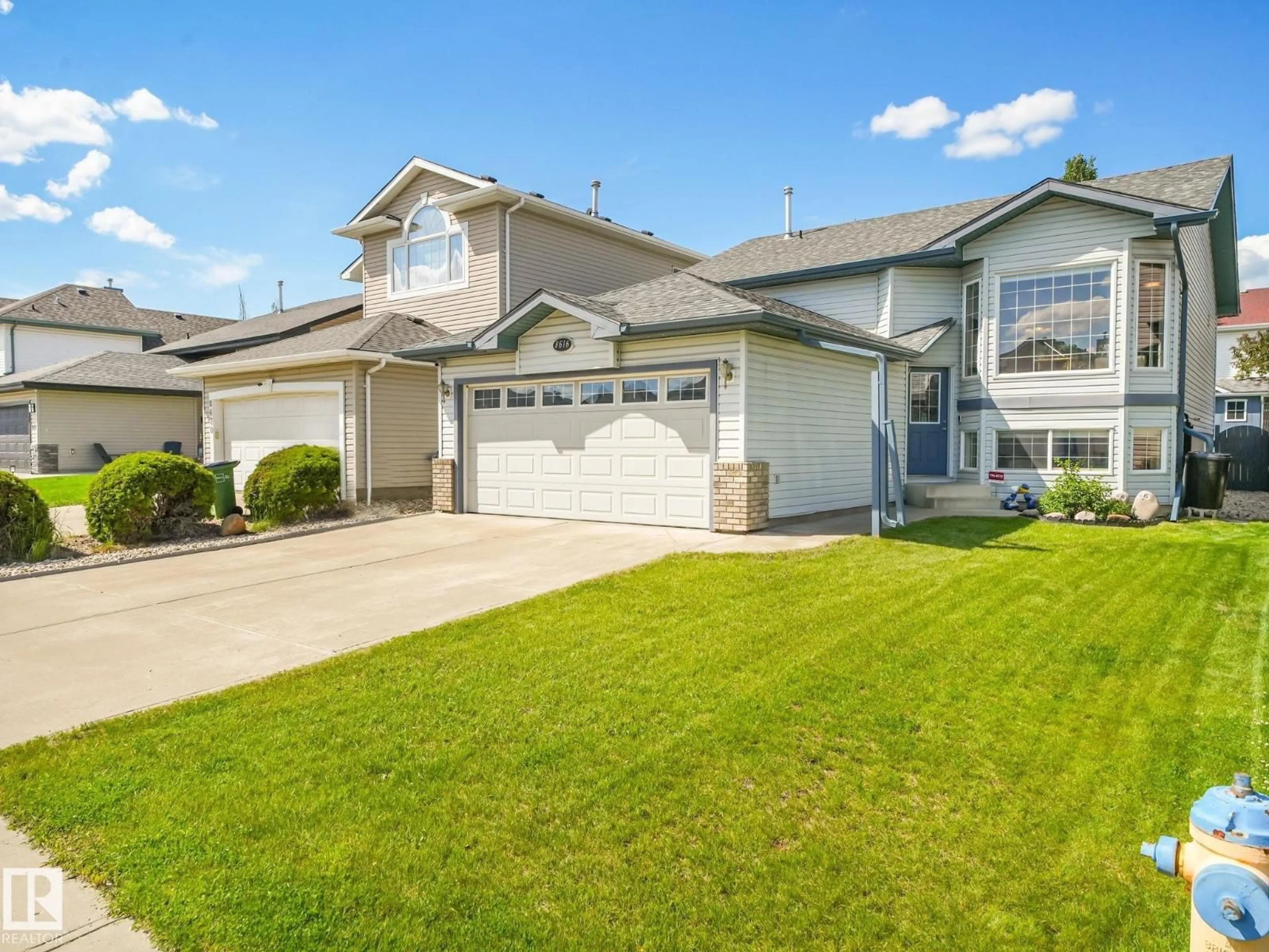 Home with vinyl exterior material, street for NW - 8616 176 AV, Edmonton Alberta T5Z0A4