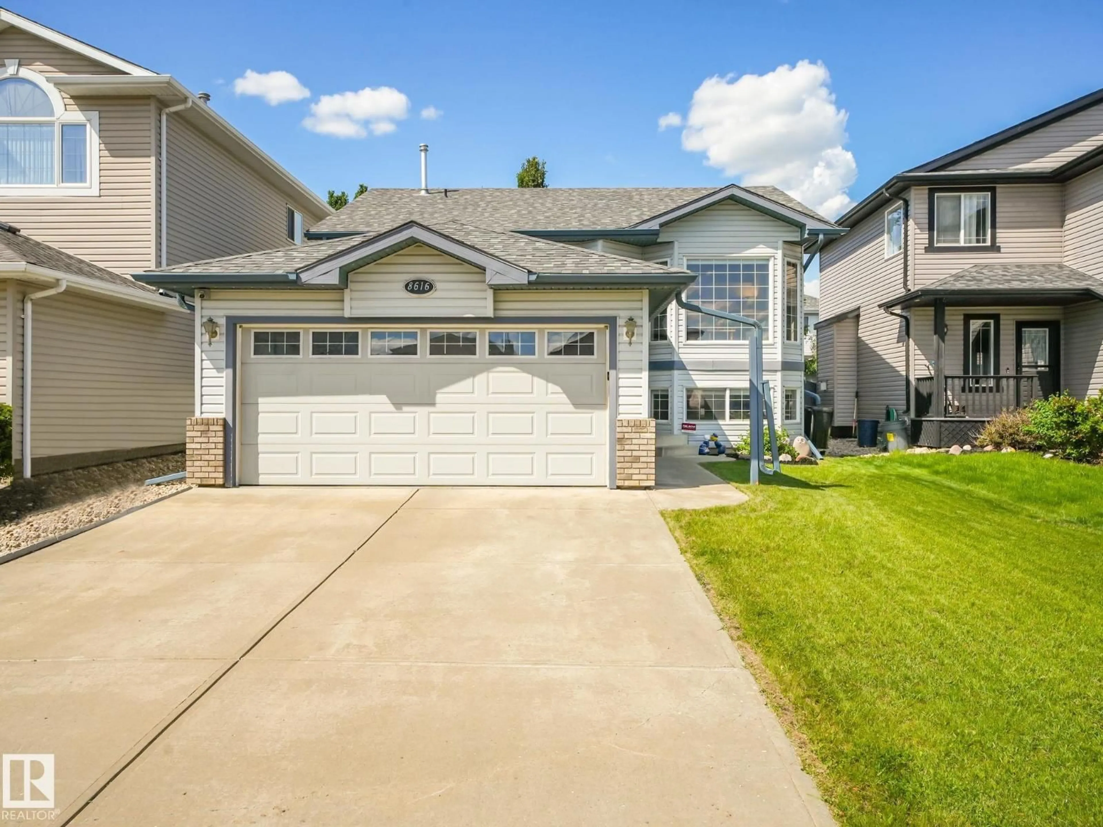 Home with vinyl exterior material, street for NW - 8616 176 AV, Edmonton Alberta T5Z0A4