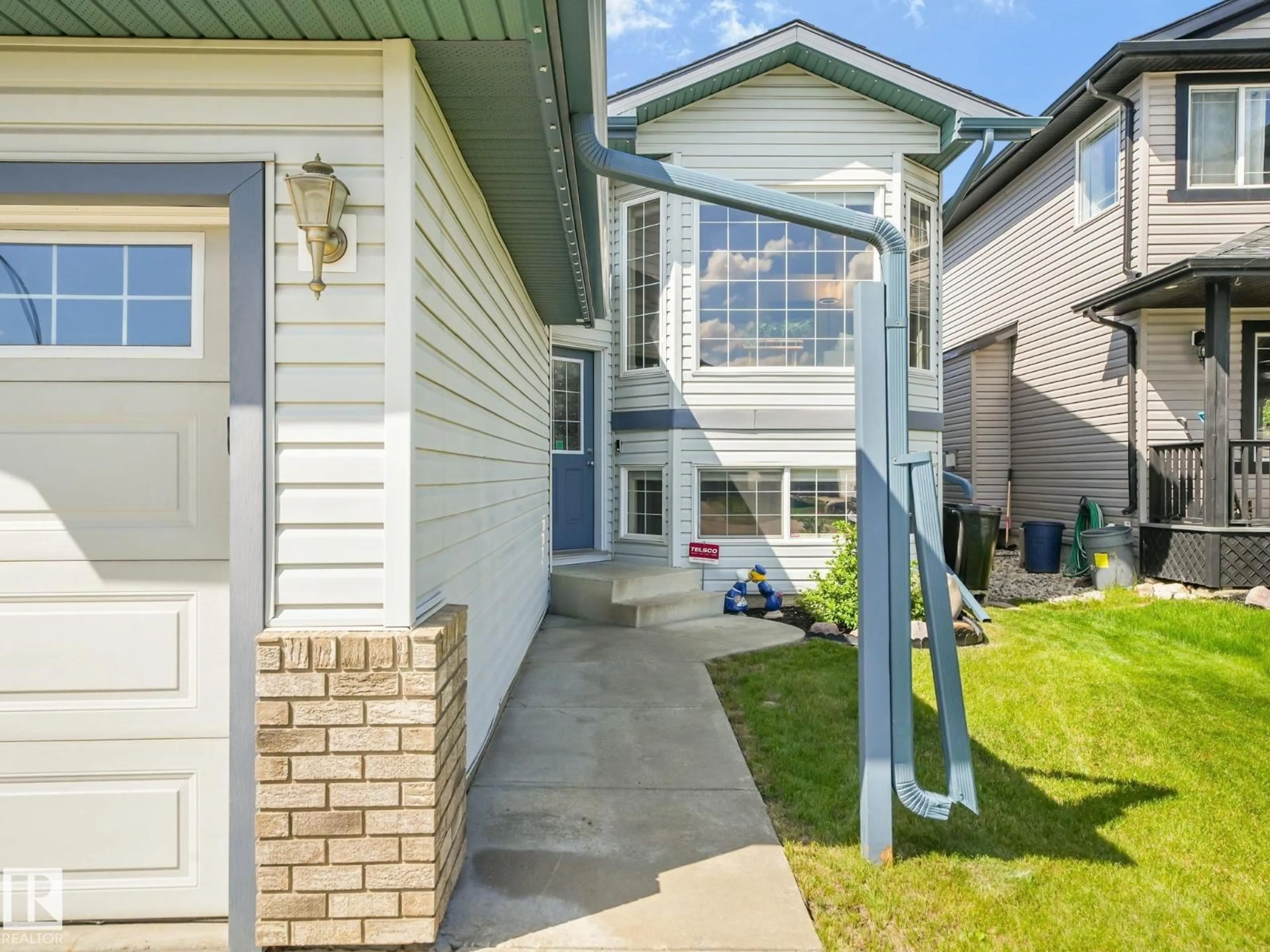 Home with vinyl exterior material, street for NW - 8616 176 AV, Edmonton Alberta T5Z0A4
