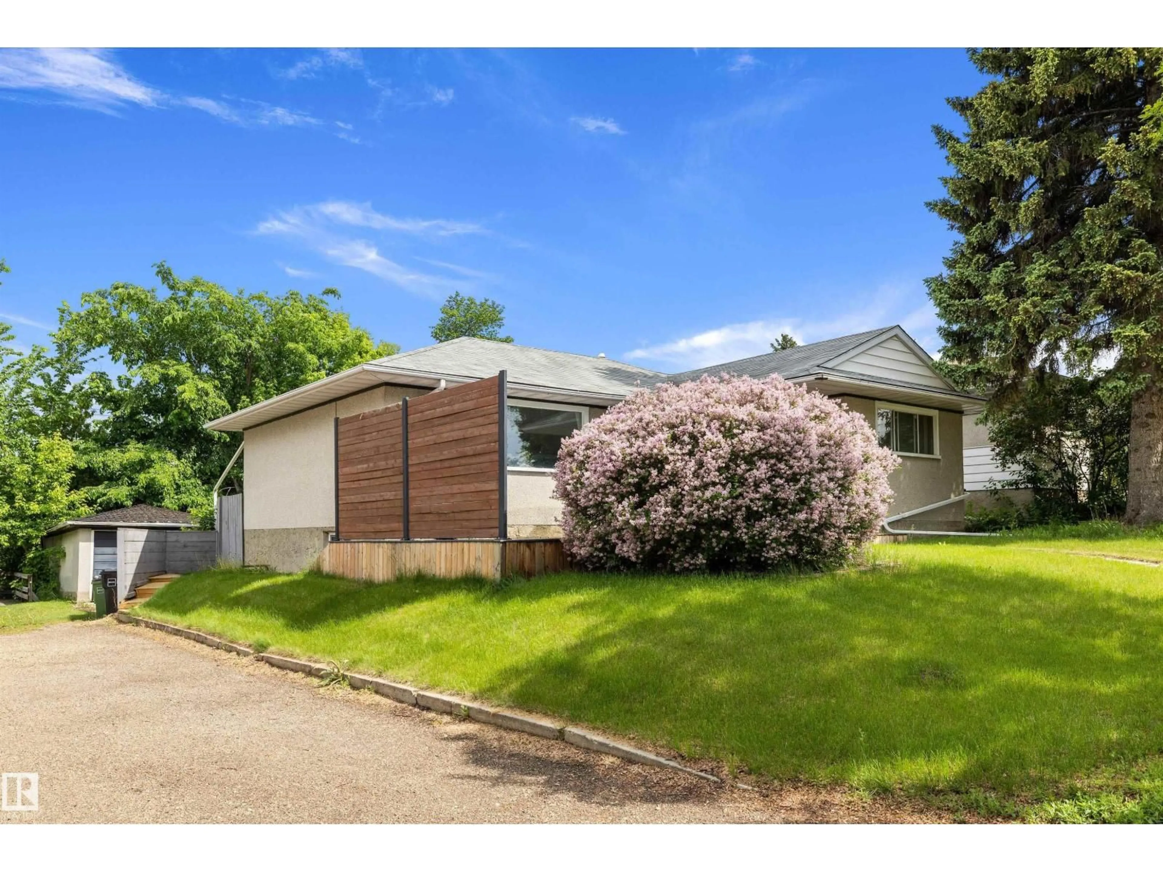 Home with vinyl exterior material, street for 10735 50 ST, Edmonton Alberta T6A2E3