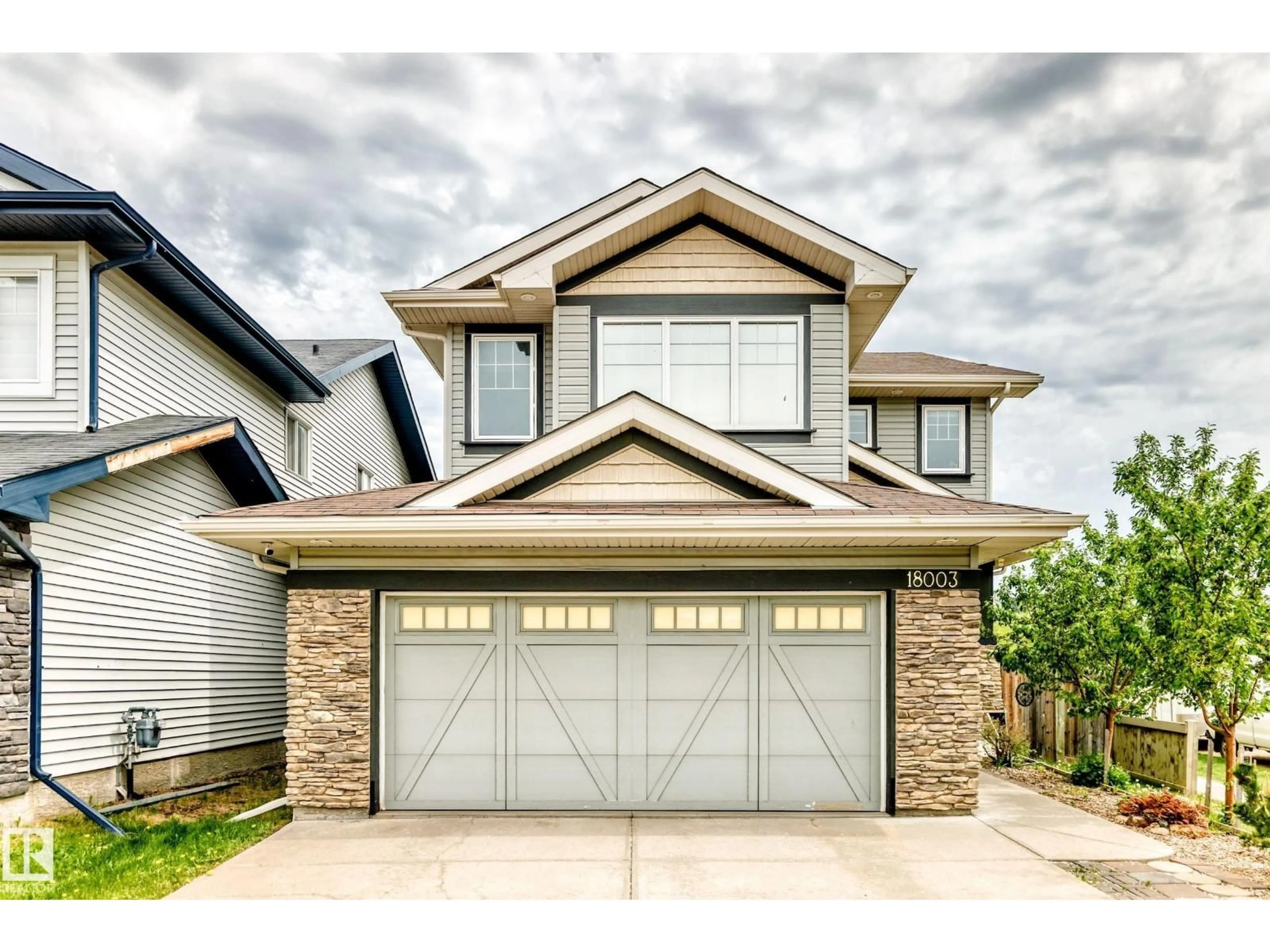 Home with vinyl exterior material, street for NW - 18003 77 ST, Edmonton Alberta T5Z0L1