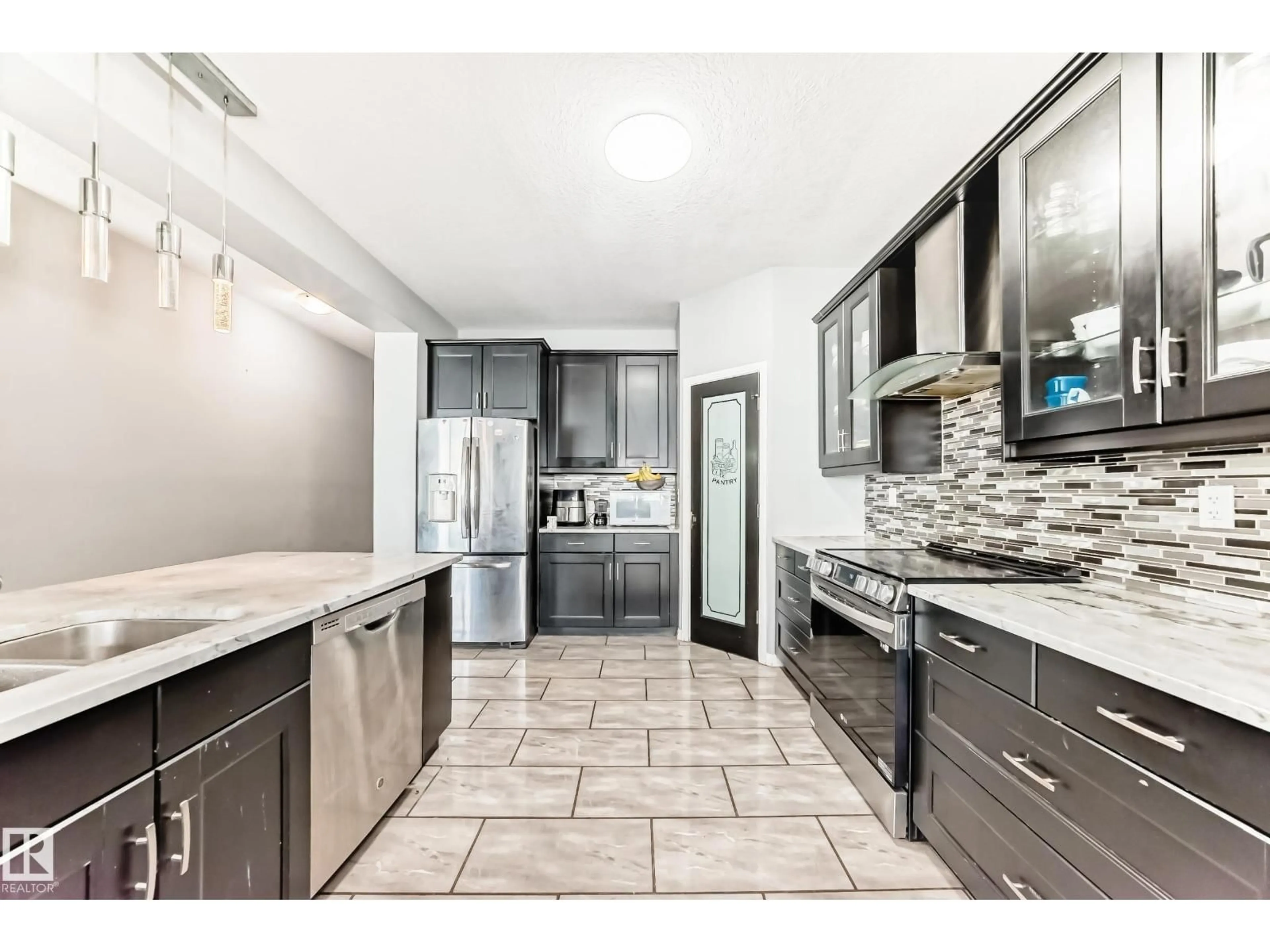 Open concept kitchen, ceramic/tile floor for NW - 16720 61 ST, Edmonton Alberta T5Y0W6