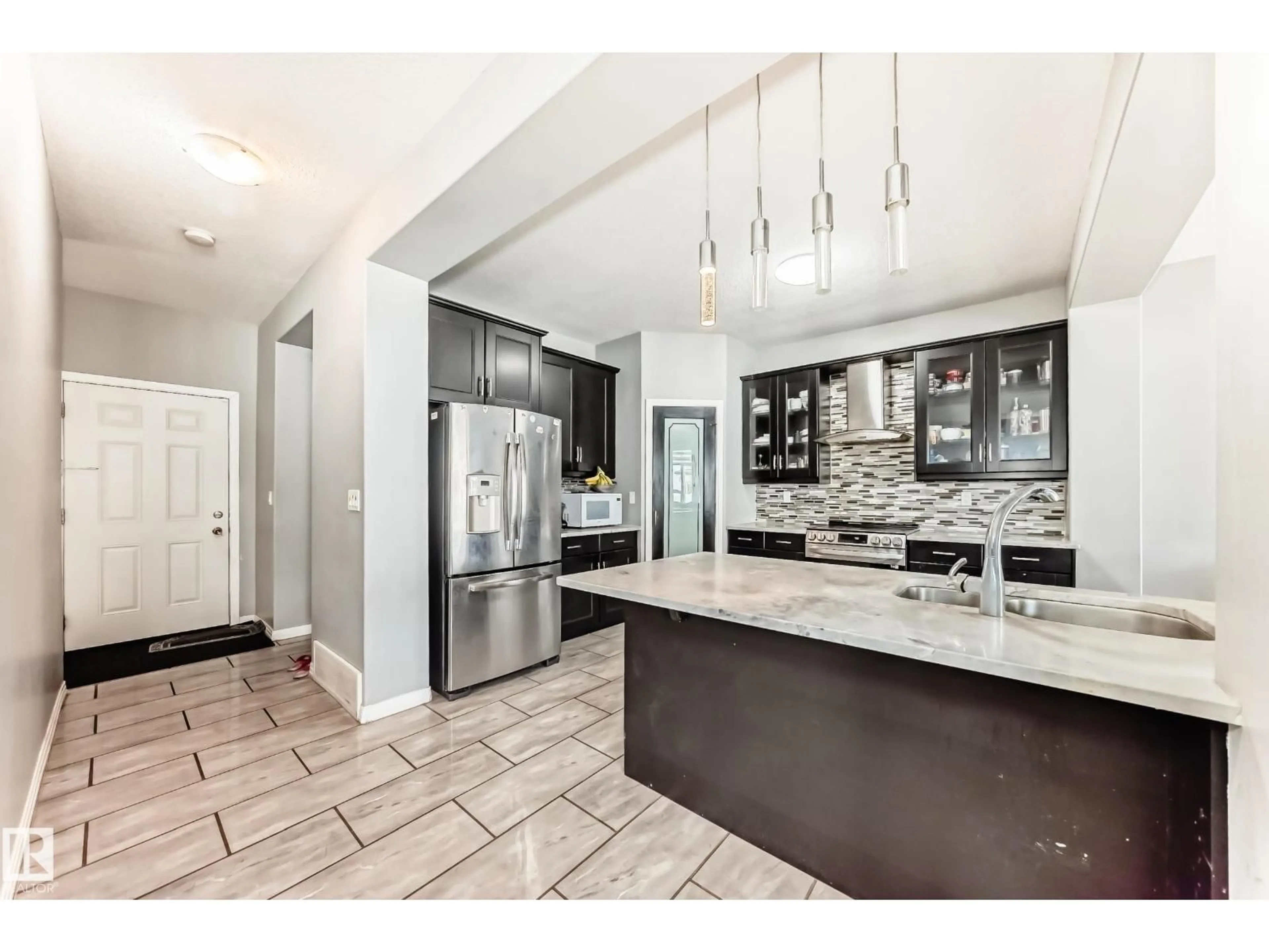 Open concept kitchen, ceramic/tile floor for NW - 16720 61 ST, Edmonton Alberta T5Y0W6