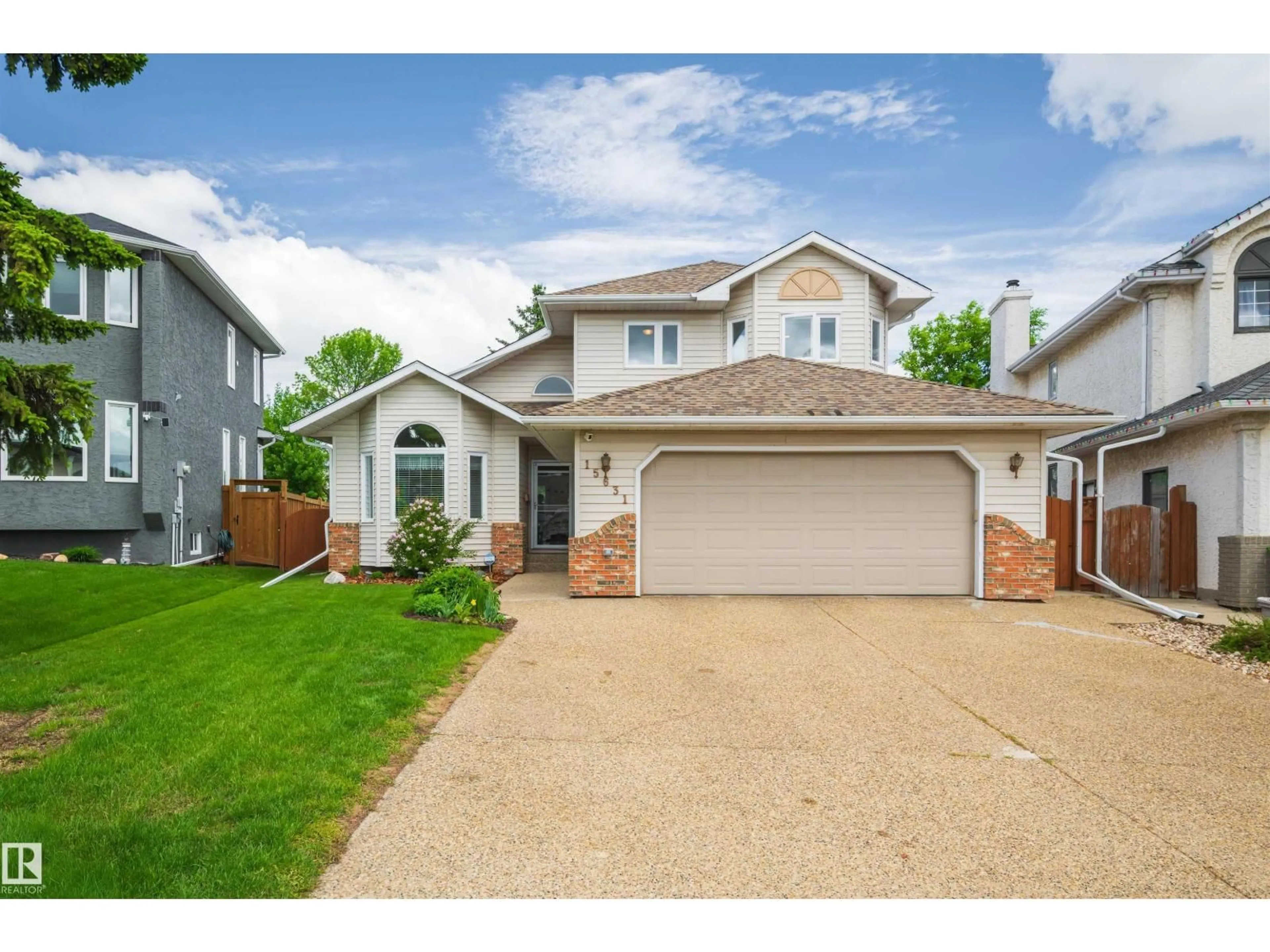 Home with vinyl exterior material, street for 15631 63 ST, Edmonton Alberta T5Y2N3