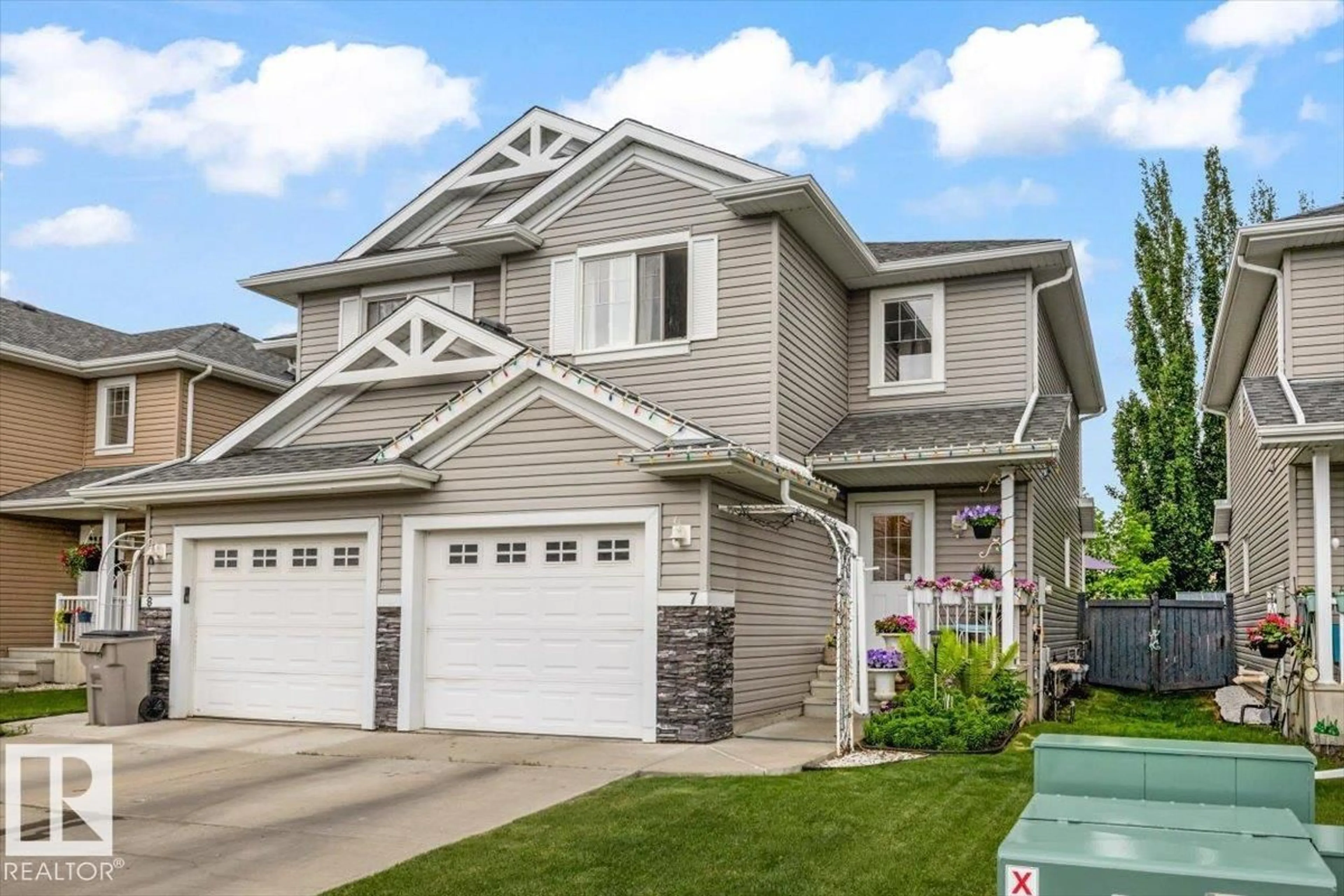 Home with vinyl exterior material, street for 7 - 5101 SOLEIL BV, Beaumont Alberta T4X0E3