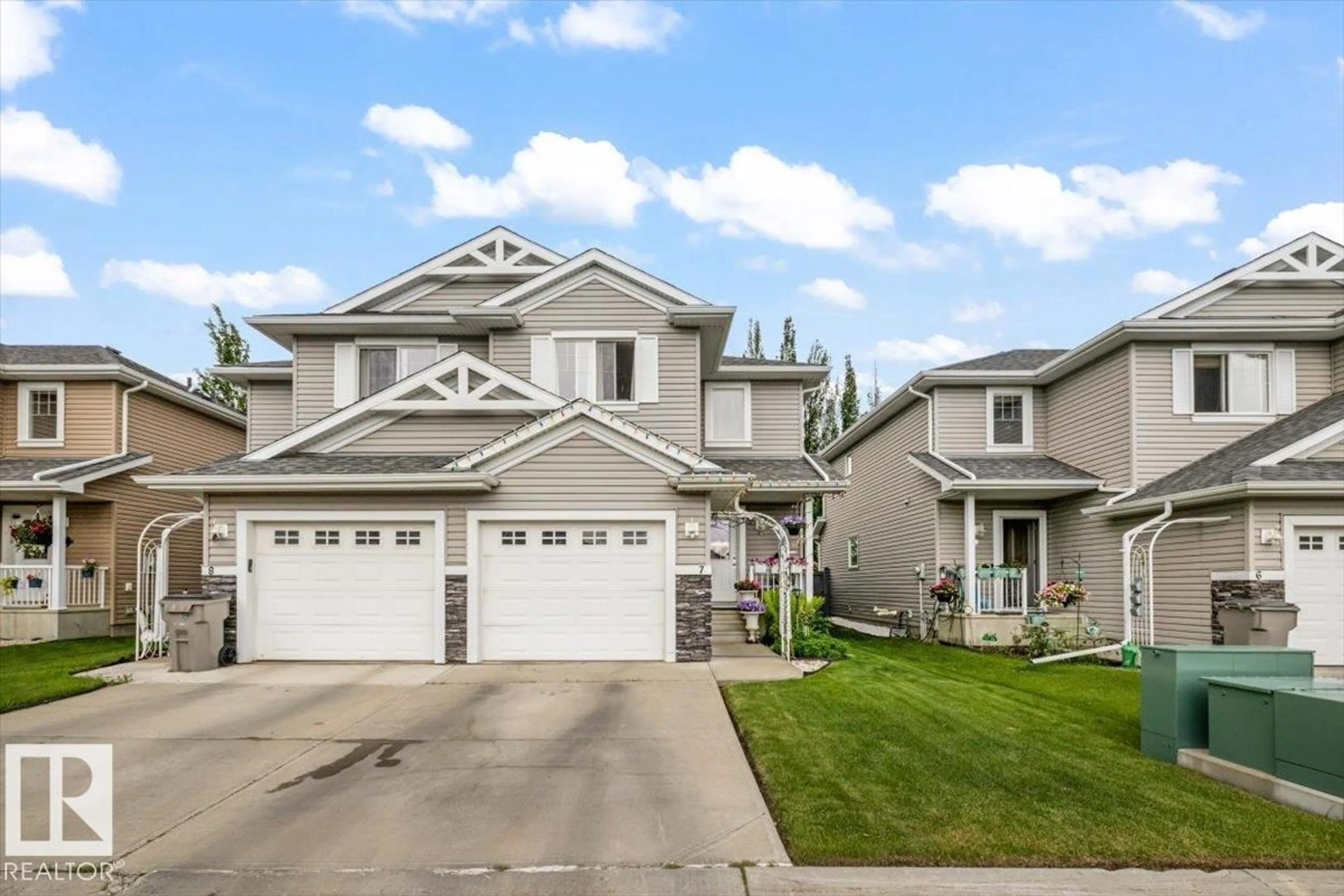 Home with vinyl exterior material, street for 7 - 5101 SOLEIL BV, Beaumont Alberta T4X0E3