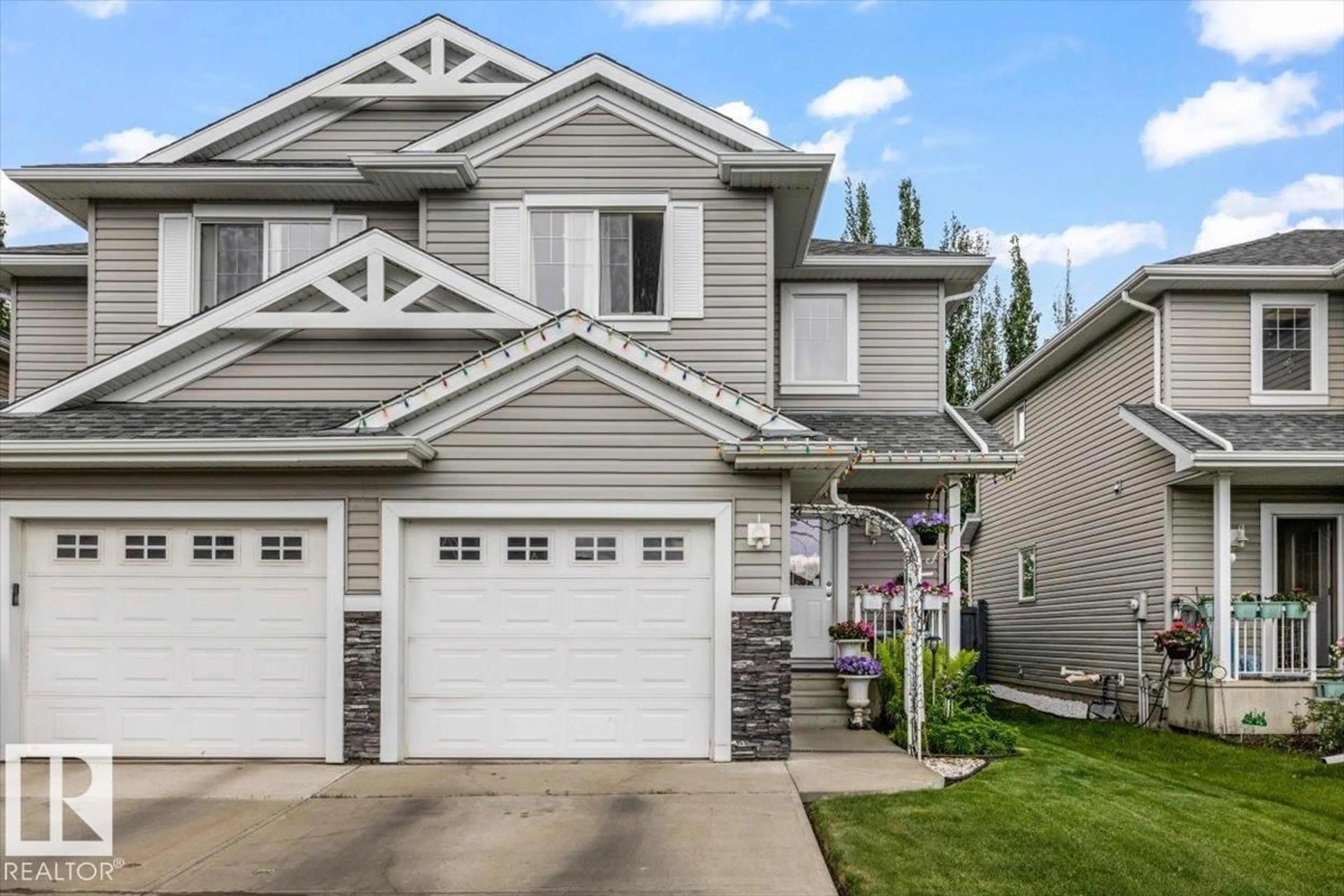 Home with vinyl exterior material, street for 7 - 5101 SOLEIL BV, Beaumont Alberta T4X0E3