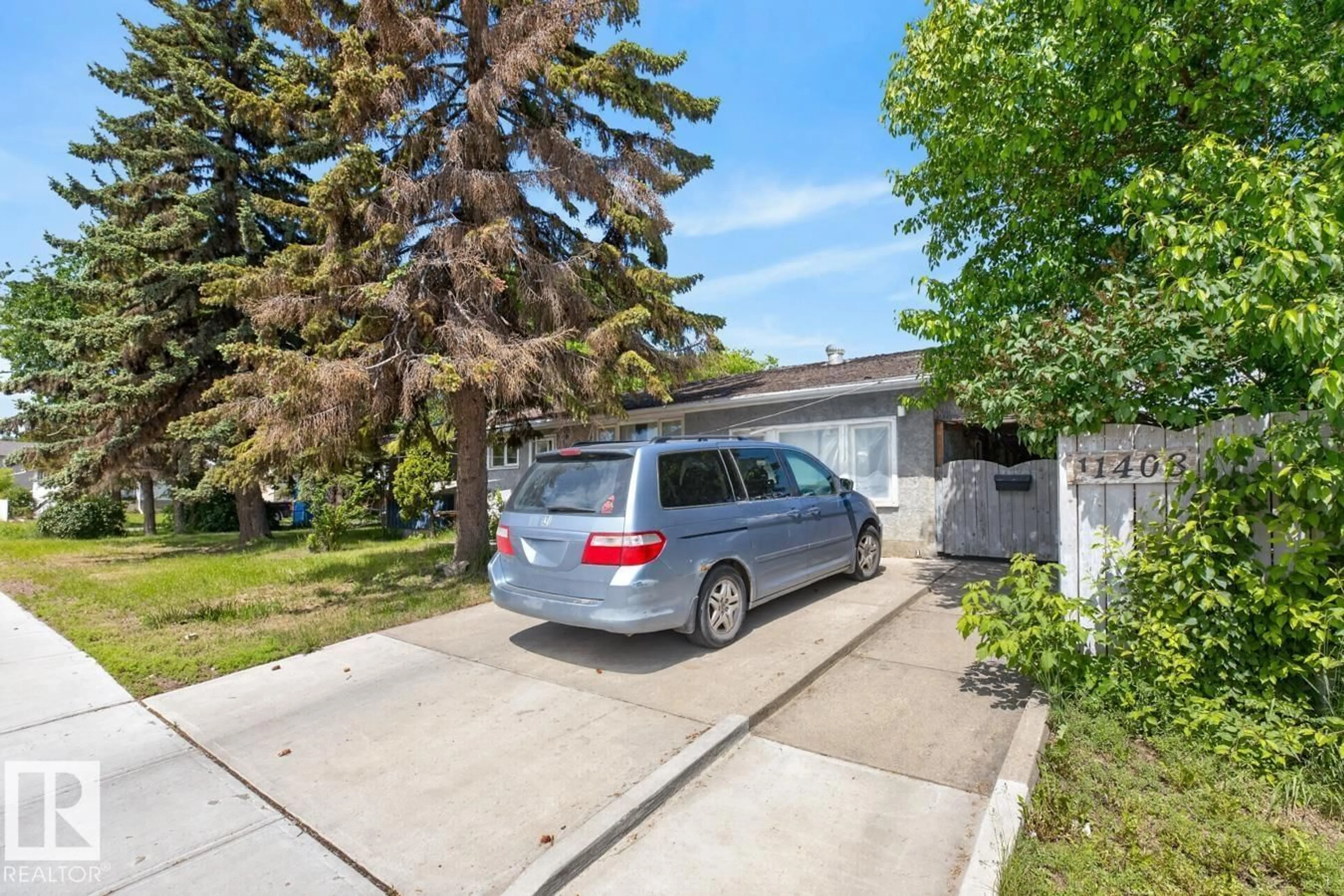 A pic from outside/outdoor area/front of a property/back of a property/a pic from drone, street for 11408 127 AV, Edmonton Alberta T5E0C6