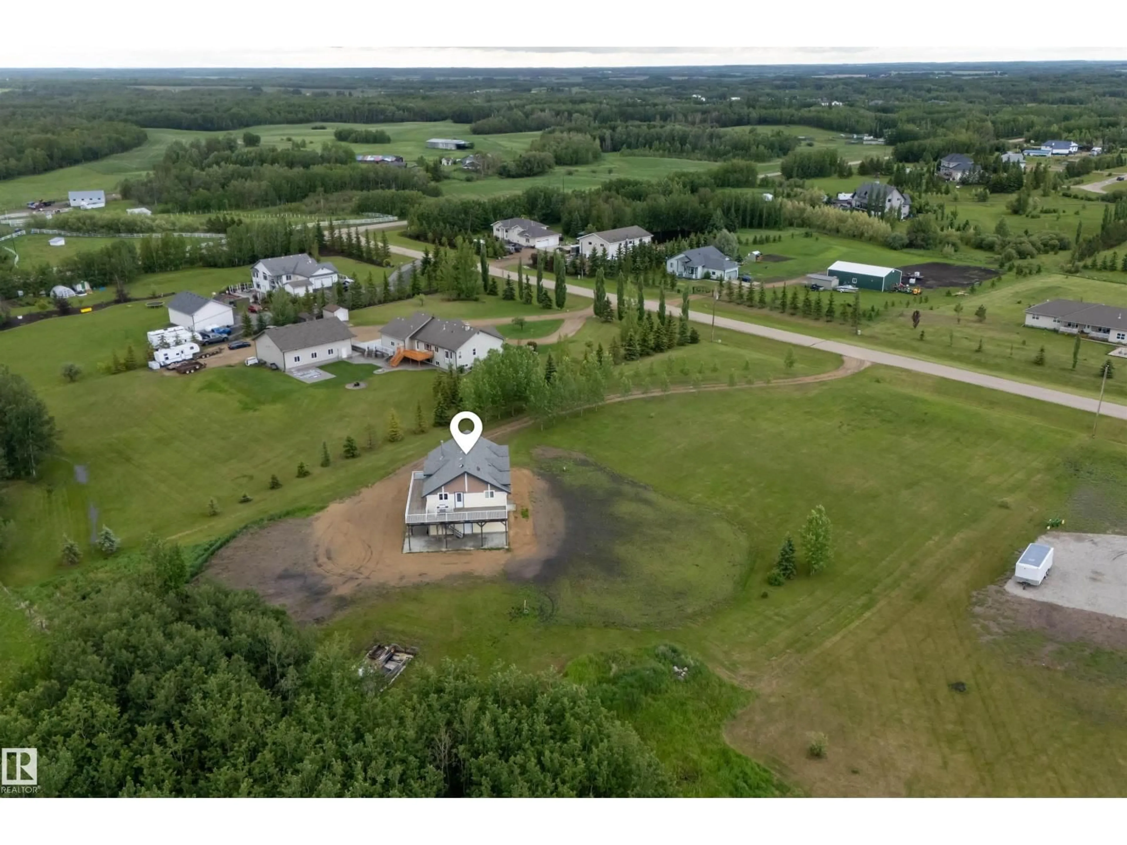 A pic from outside/outdoor area/front of a property/back of a property/a pic from drone, unknown for 232 - 60 RNG RD, Rural Leduc County Alberta T4X0L1
