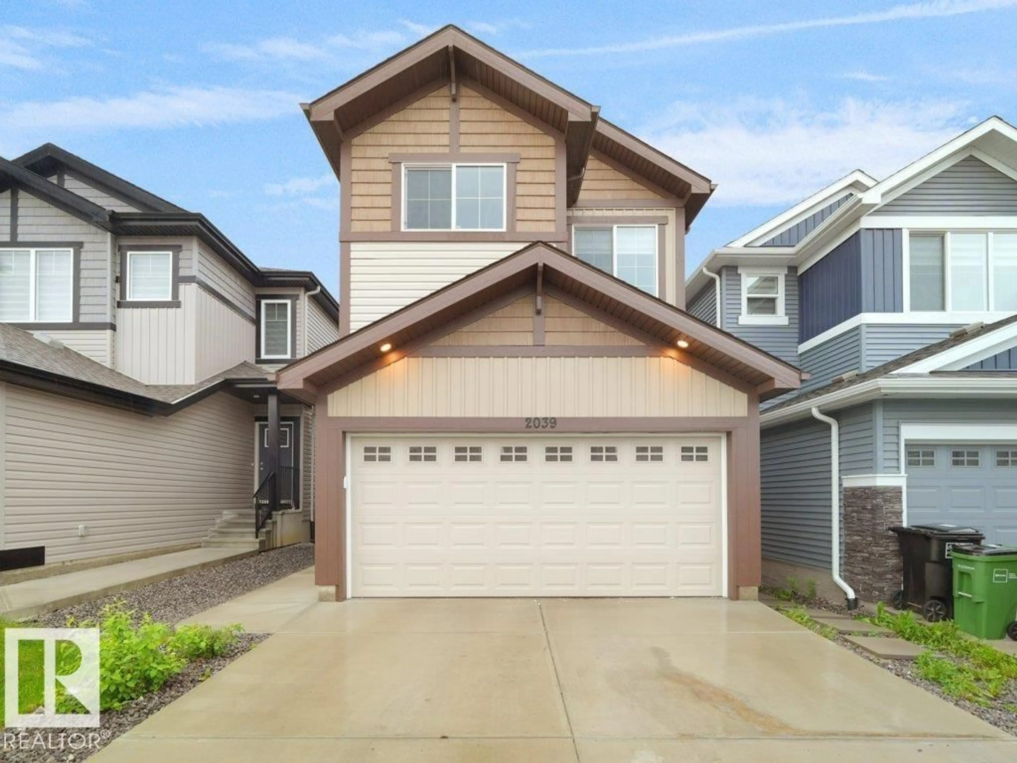 Home with vinyl exterior material, street for 2039 13 AV, Edmonton Alberta T6T2R8