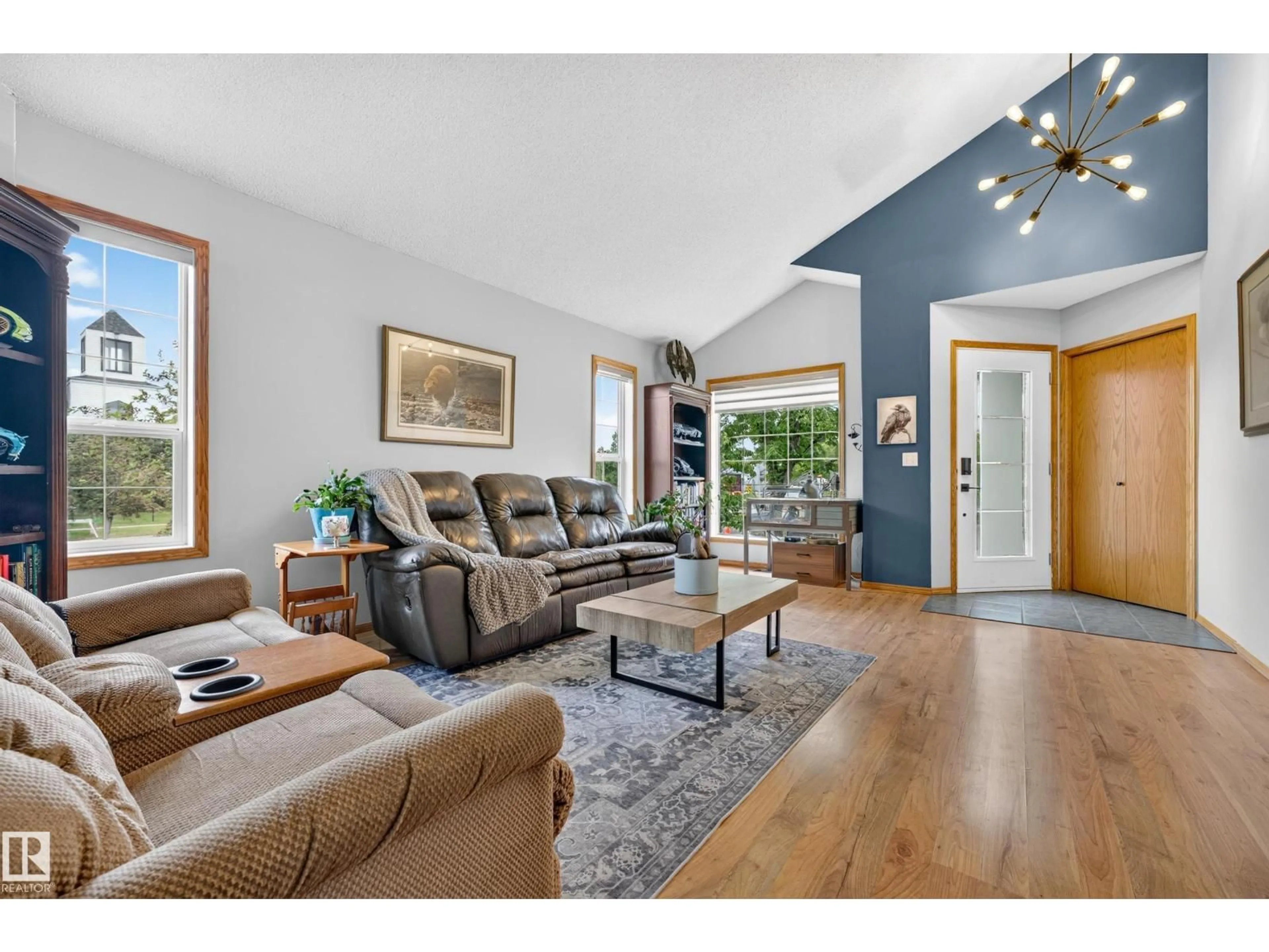 Living room with furniture, wood/laminate floor for 1 PRIMROSE BV, Sherwood Park Alberta T8H2B8