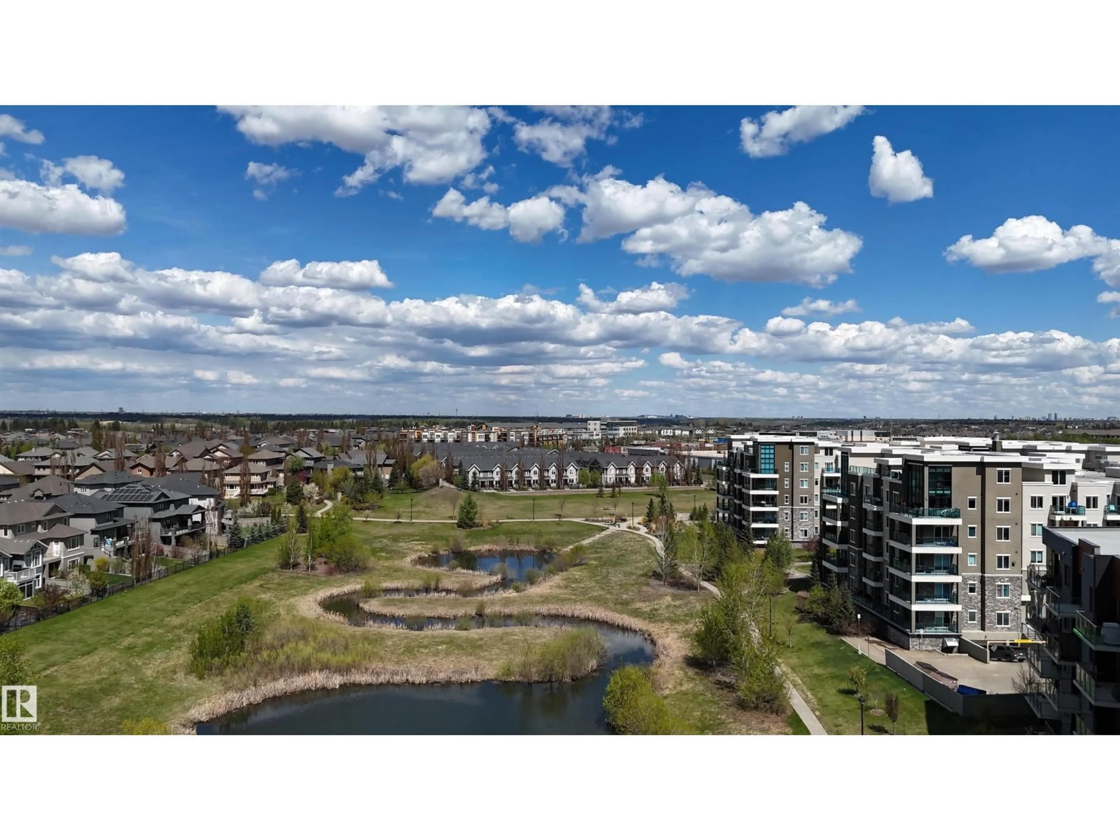 A pic from outside/outdoor area/front of a property/back of a property/a pic from drone, water/lake/river/ocean view for 205 - 1316 WINDERMERE WY, Edmonton Alberta T6W2J3