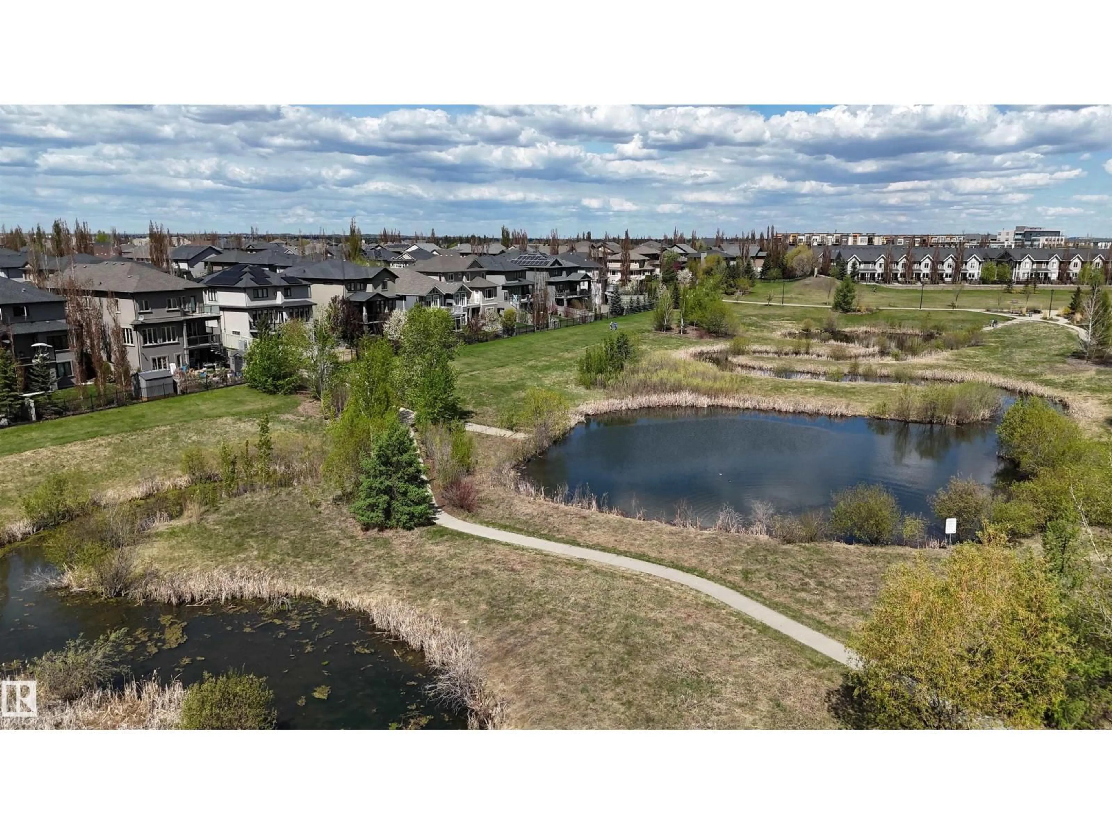 A pic from outside/outdoor area/front of a property/back of a property/a pic from drone, water/lake/river/ocean view for 205 - 1316 WINDERMERE WY, Edmonton Alberta T6W2J3