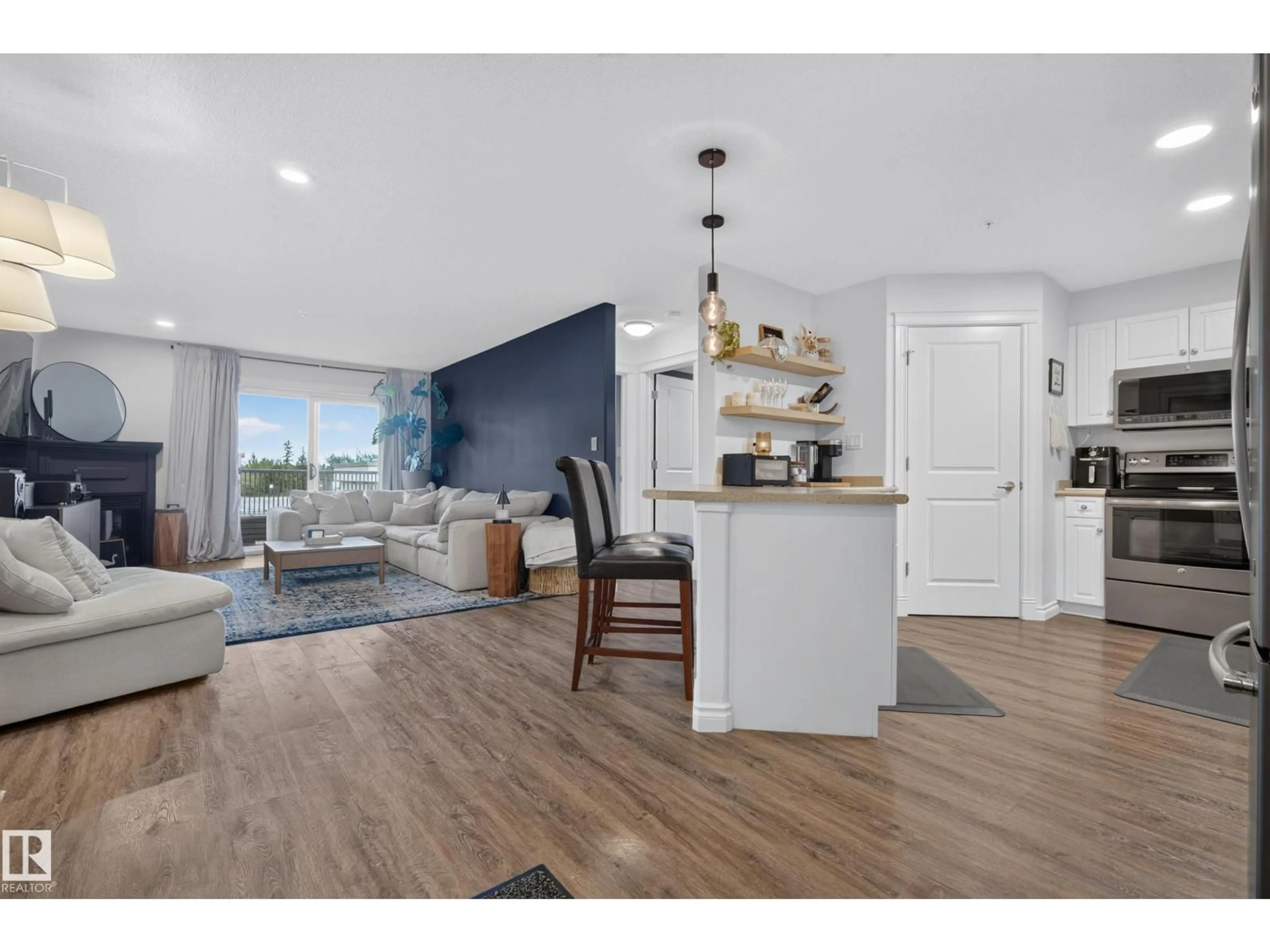 Open concept kitchen, wood/laminate floor for 204A - 6 SPRUCE RIDGE DR, Spruce Grove Alberta T7X4M5