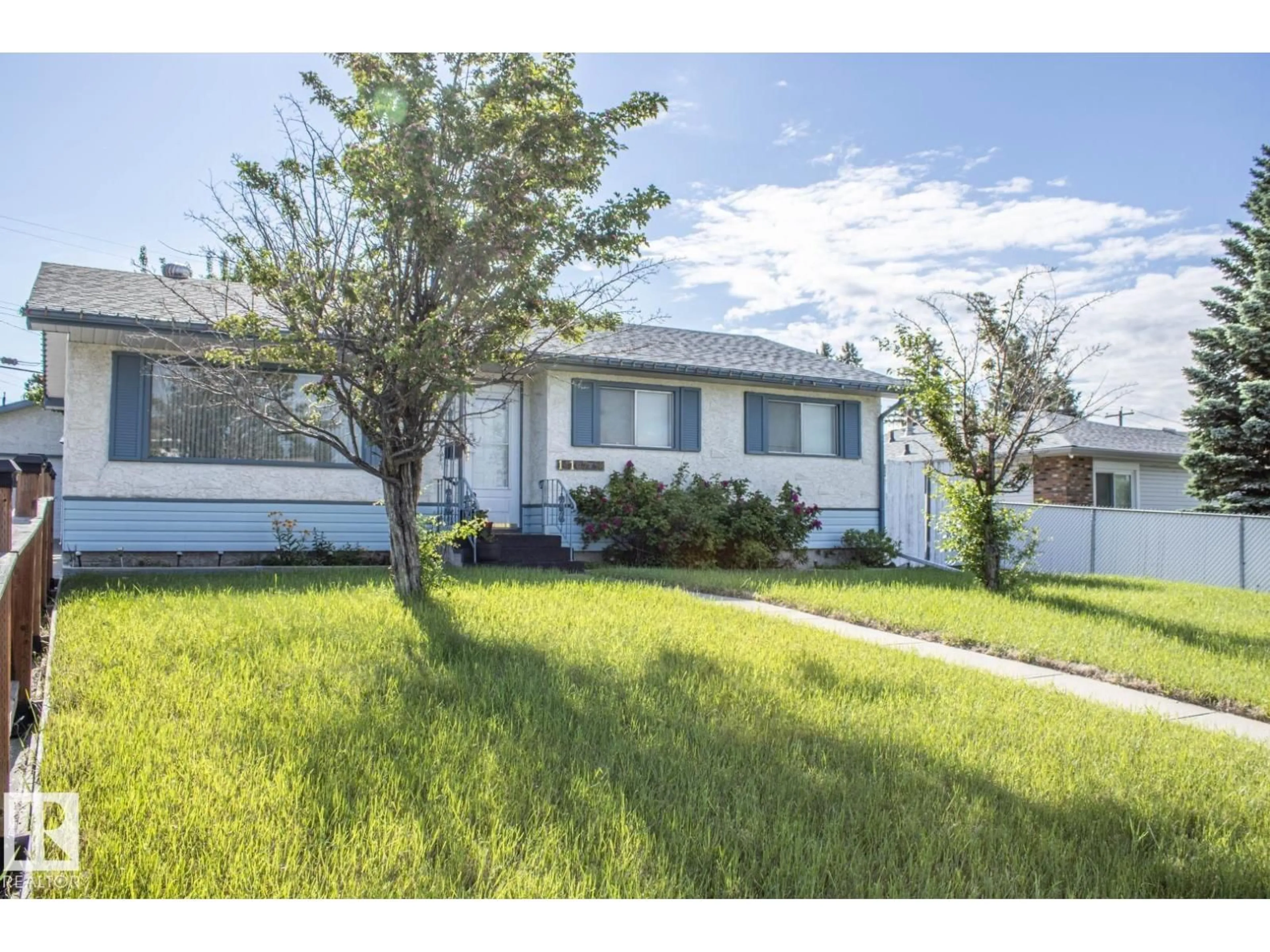 Home with vinyl exterior material, street for 14107 58 ST, Edmonton Alberta T5A1N3
