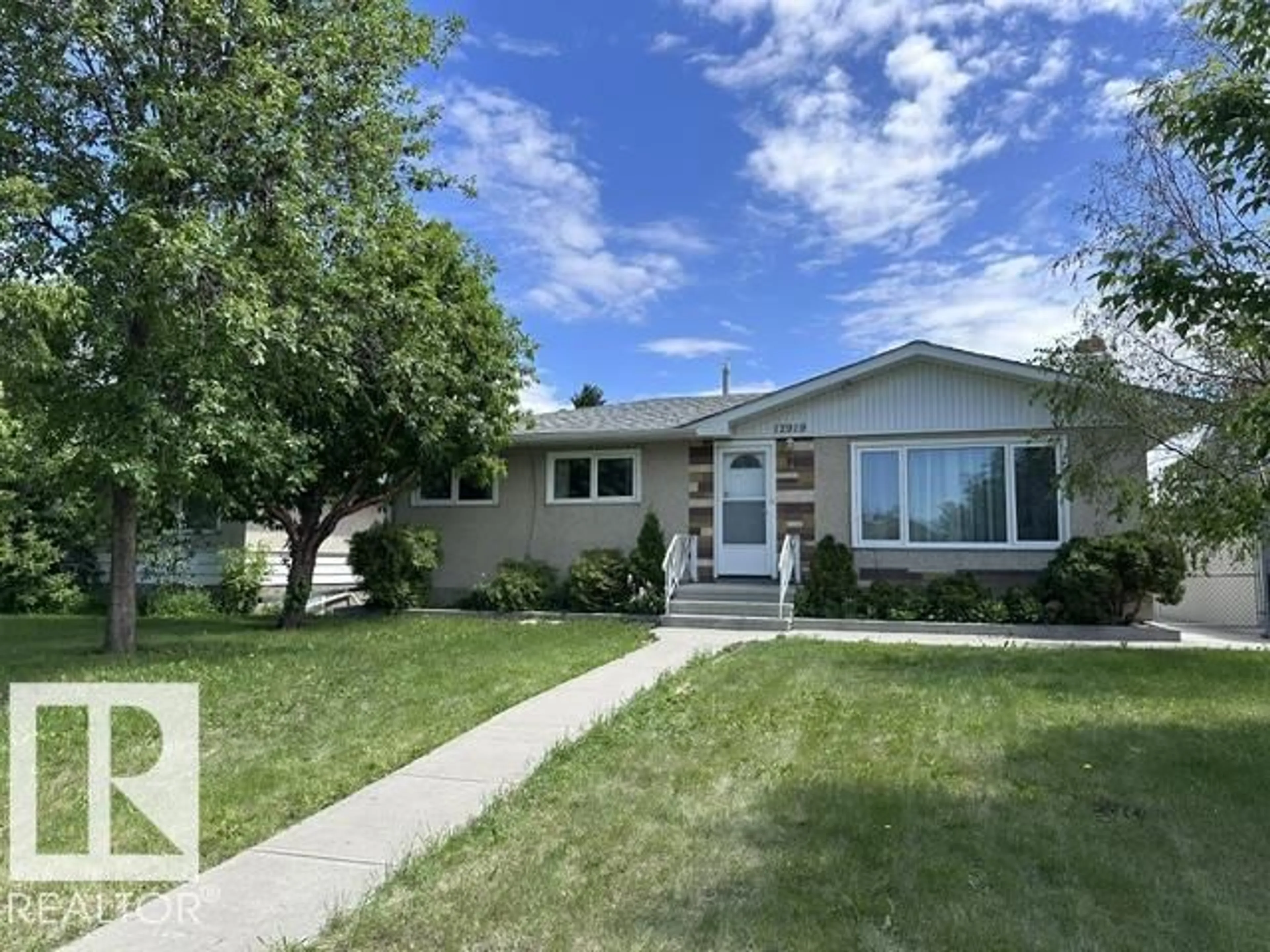 Home with vinyl exterior material, street for NW - 12919 86 ST, Edmonton Alberta T5E3A9