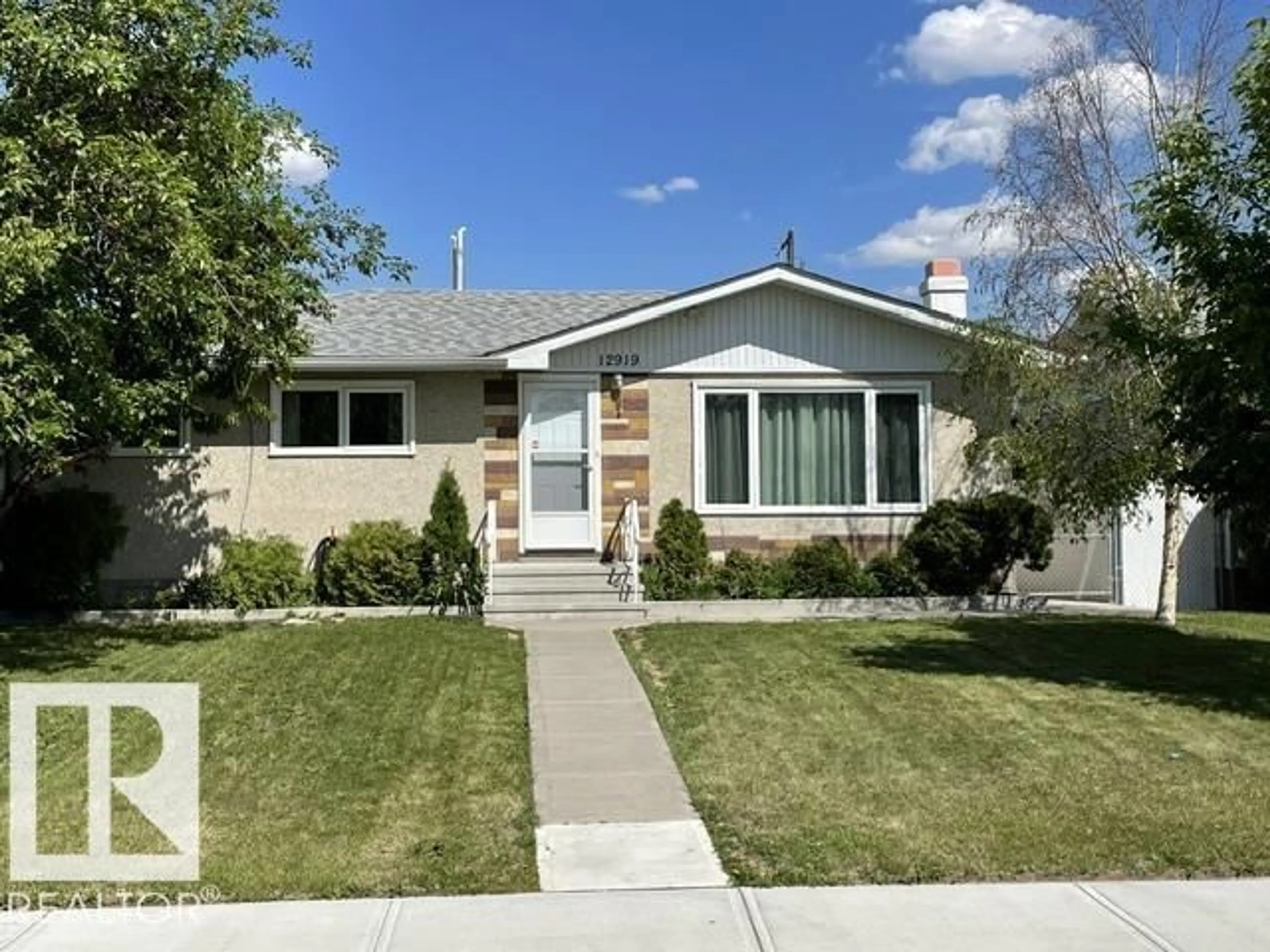Home with vinyl exterior material, street for NW - 12919 86 ST, Edmonton Alberta T5E3A9