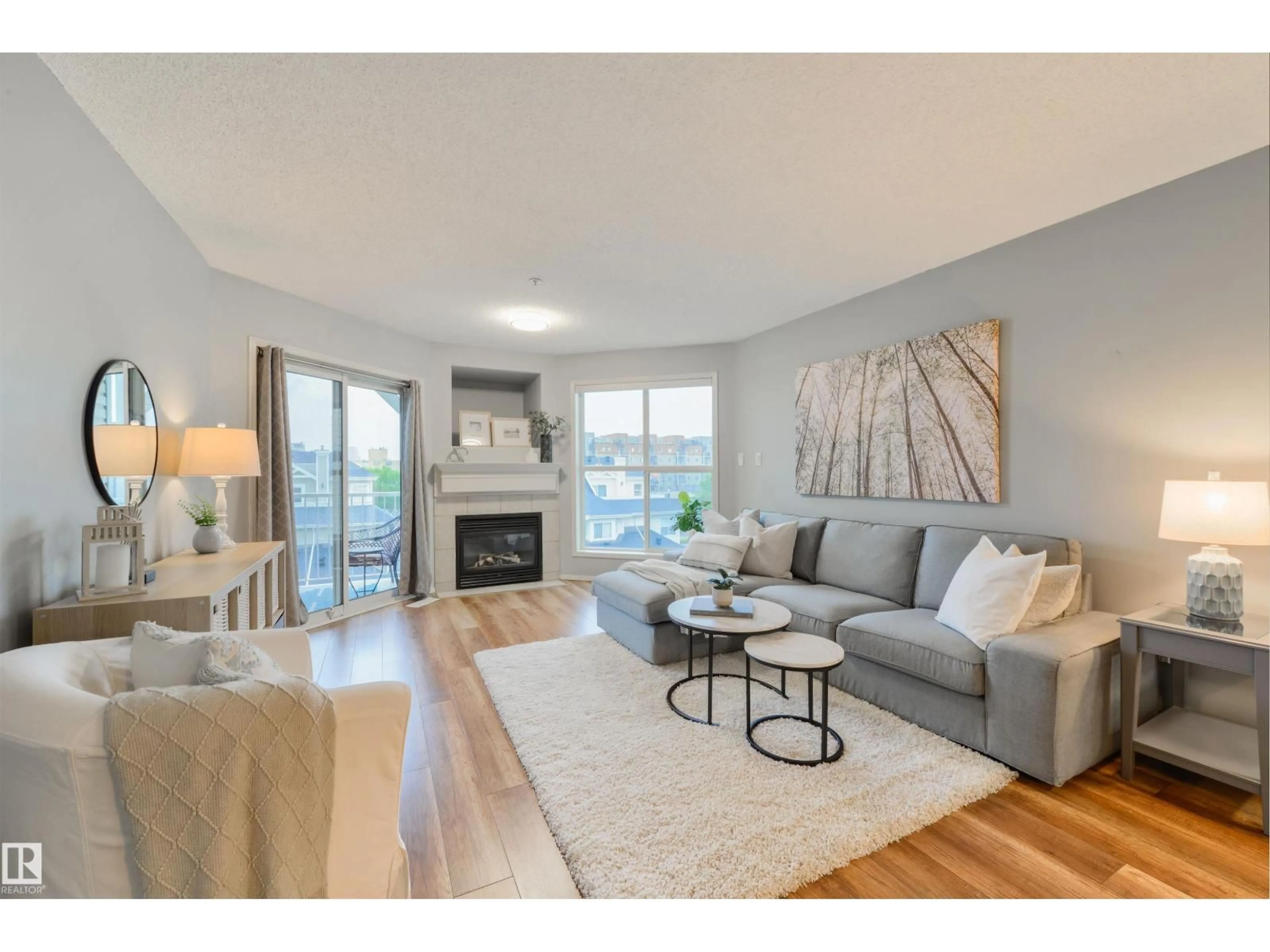 Living room with furniture, wood/laminate floor for #402 - 10221 111 ST, Edmonton Alberta T5K2W5
