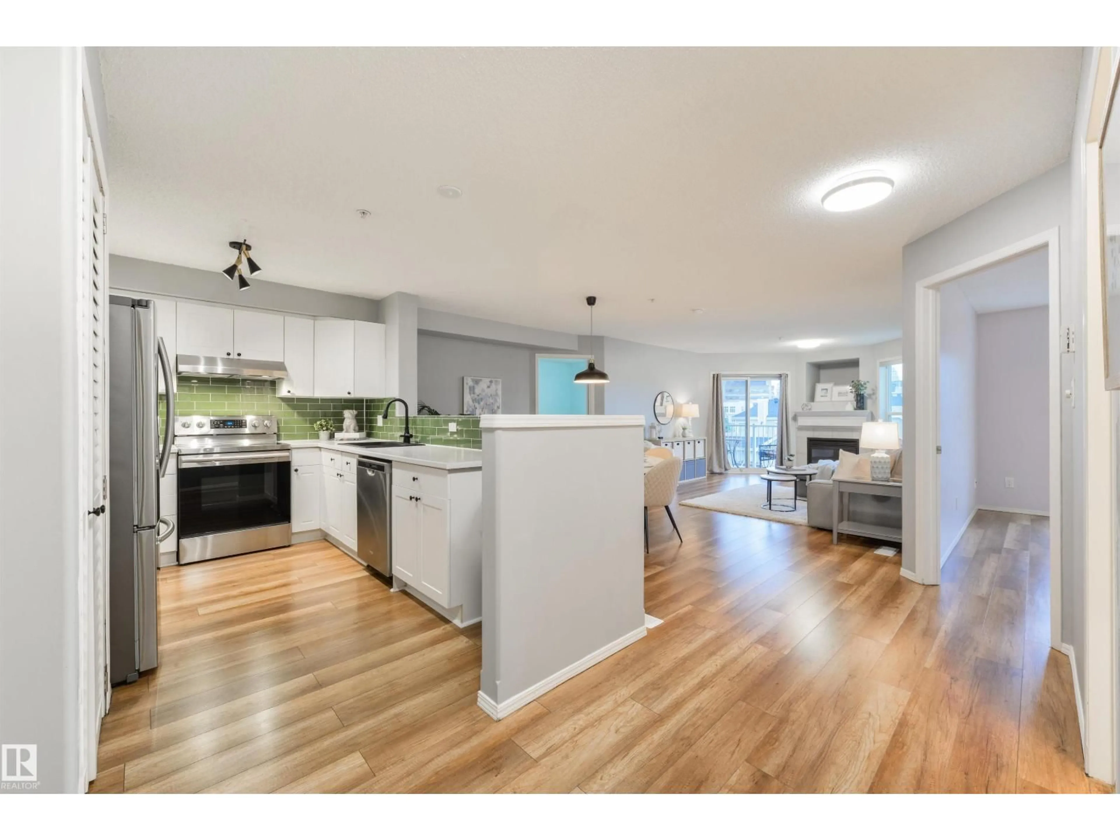 Open concept kitchen, wood/laminate floor for #402 - 10221 111 ST, Edmonton Alberta T5K2W5
