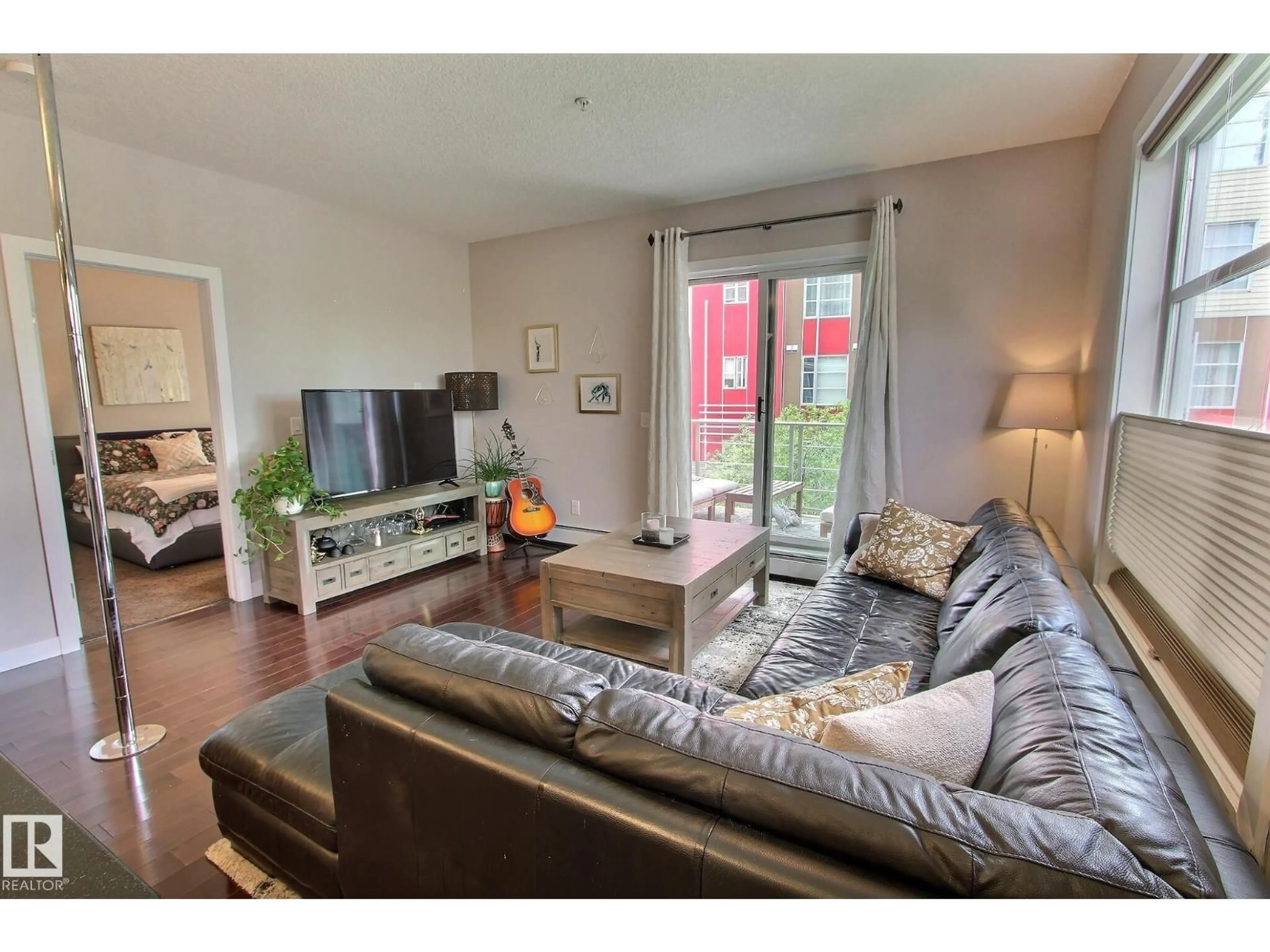 Living room with furniture, wood/laminate floor for 206 - 2584 ANDERSON WY, Edmonton Alberta T6W0R2
